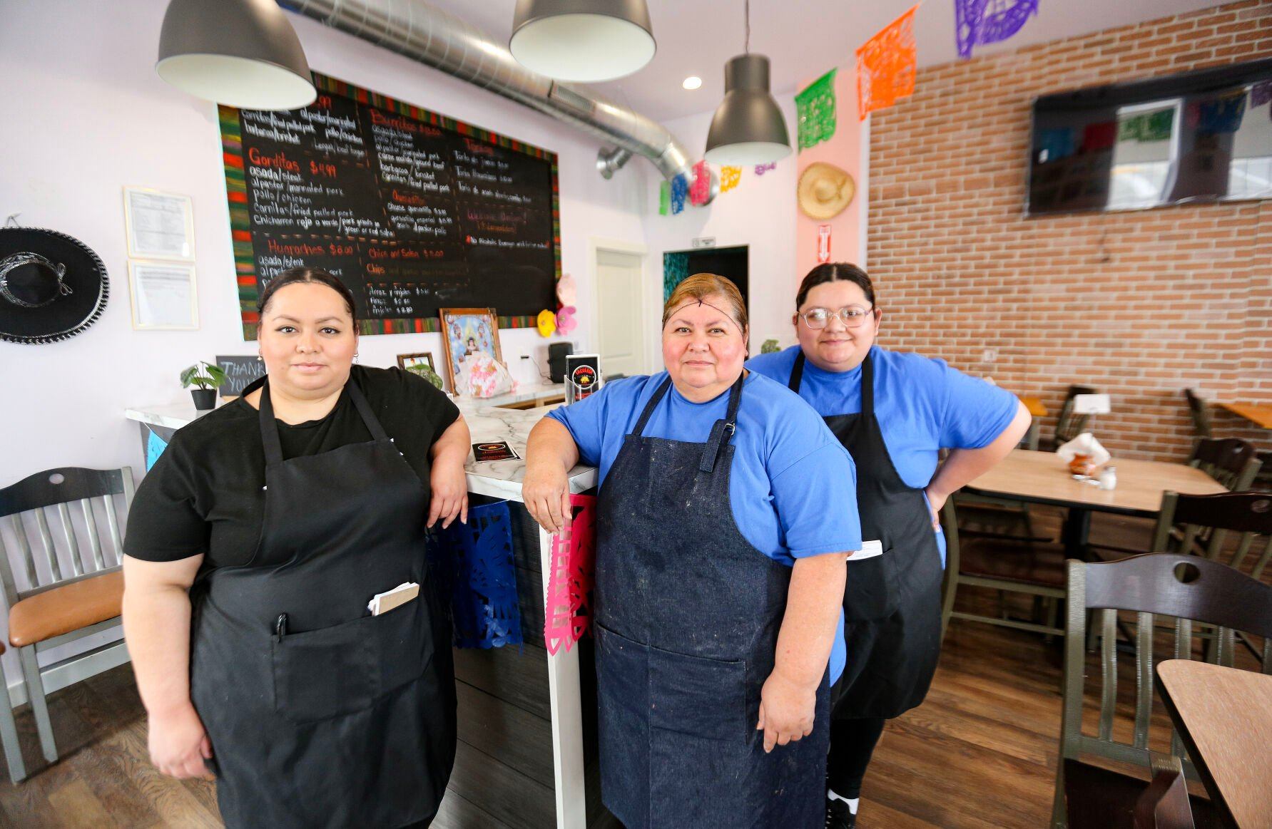 Brenda Espinoza-Lopez (left), Alicia Lopez, and Valeria Espinoza, have opened Taquería Monterrey in Dyersville, Iowa.    PHOTO CREDIT: Dave Kettering