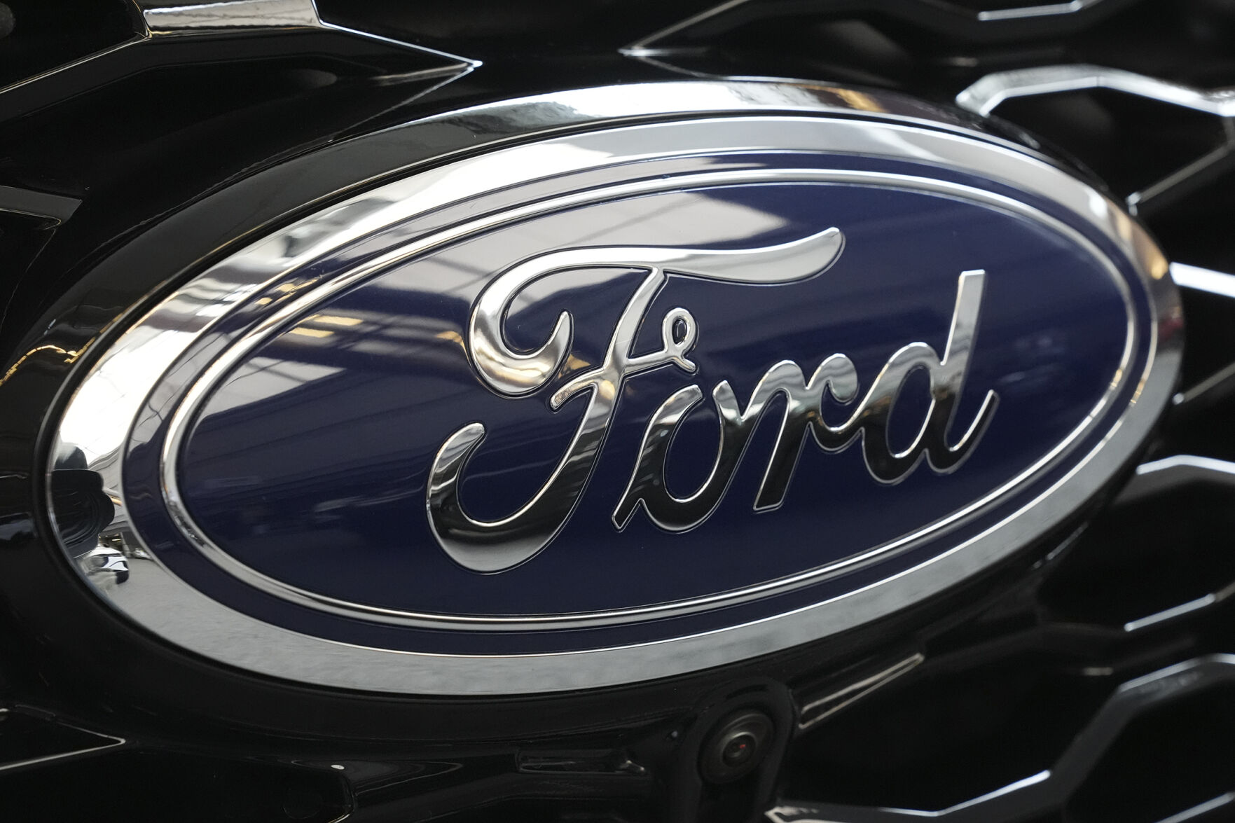 <p>FILE - The Ford logo is seen on the grill of a Ford Explorer on display at the Pittsburgh International Auto Show in Pittsburgh, on Feb. 15, 2024. (AP Photo/Gene J. Puskar, File)</p>   PHOTO CREDIT: Gene J. Puskar