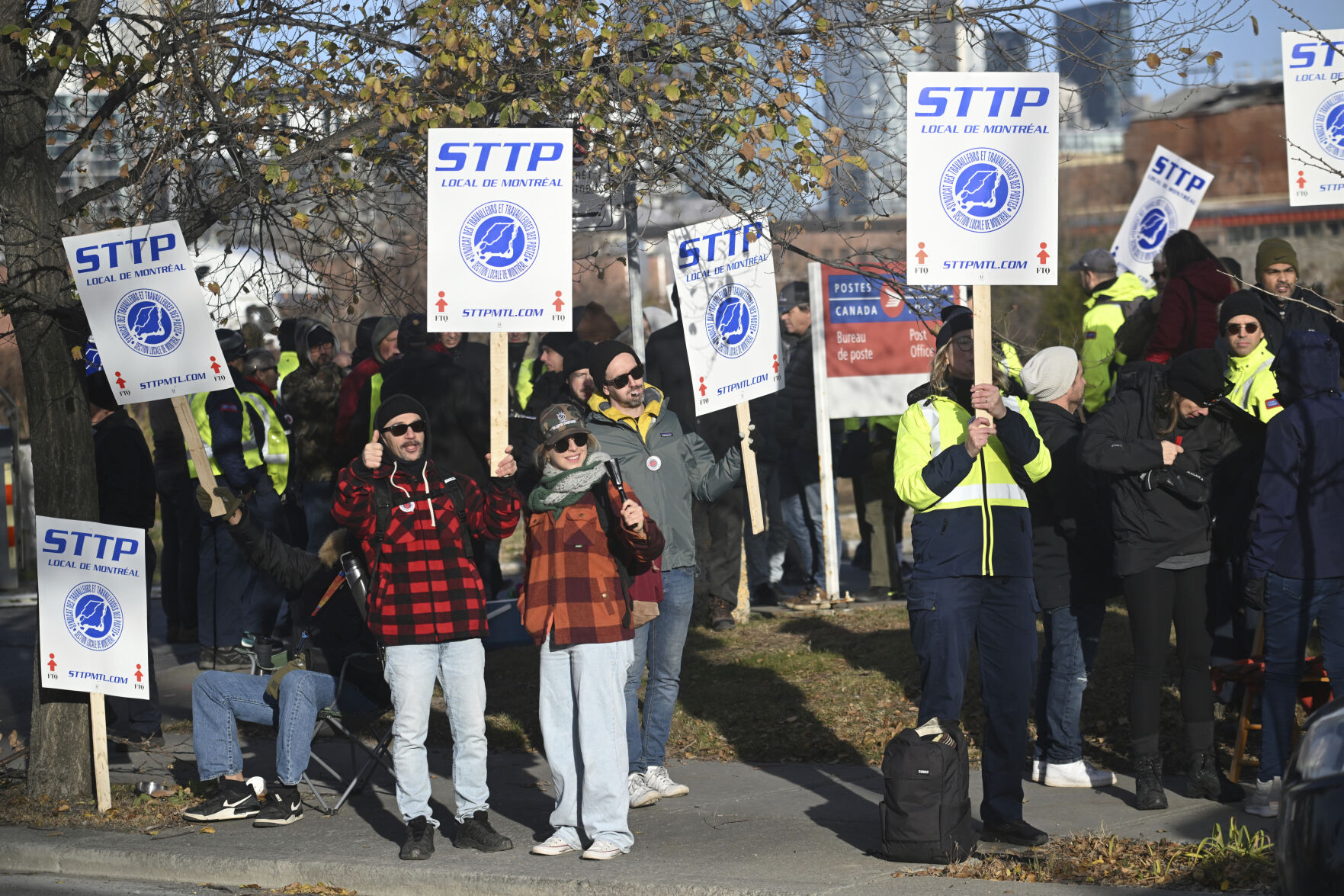 <p>Canada Post workers picket outside a sorting plant in Montreal on Friday, Nov.15, 2024. (Graham Hughes/The Canadian Press via AP)</p>   PHOTO CREDIT: Graham Hughes - foreign subscriber, ASSOCIATED PRESS