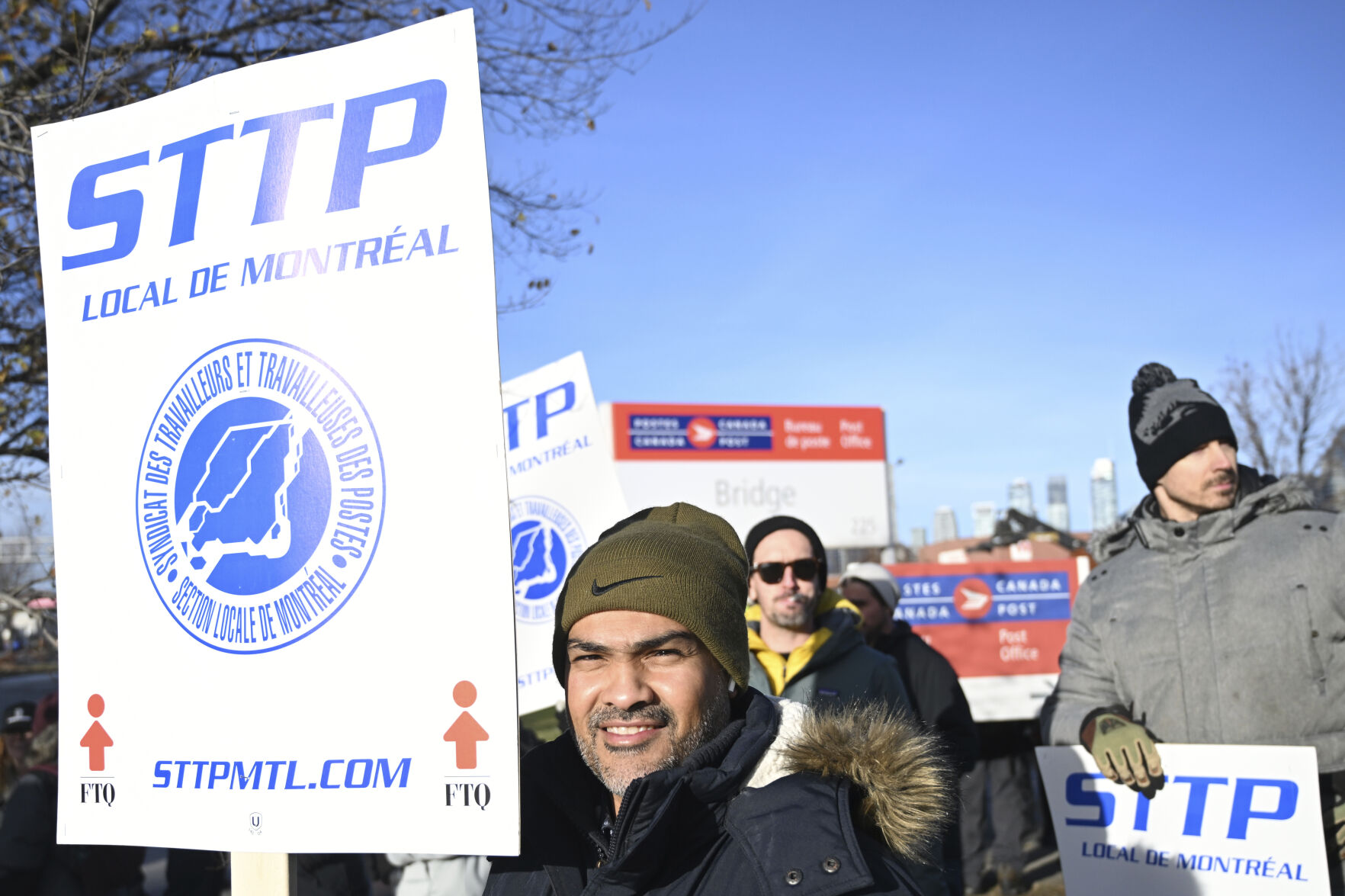 <p>Canada Post workers picket outside a sorting plant in Montreal on Friday, Nov.15, 2024. (Graham Hughes/The Canadian Press via AP)</p>   PHOTO CREDIT: Graham Hughes - foreign subscriber, ASSOCIATED PRESS