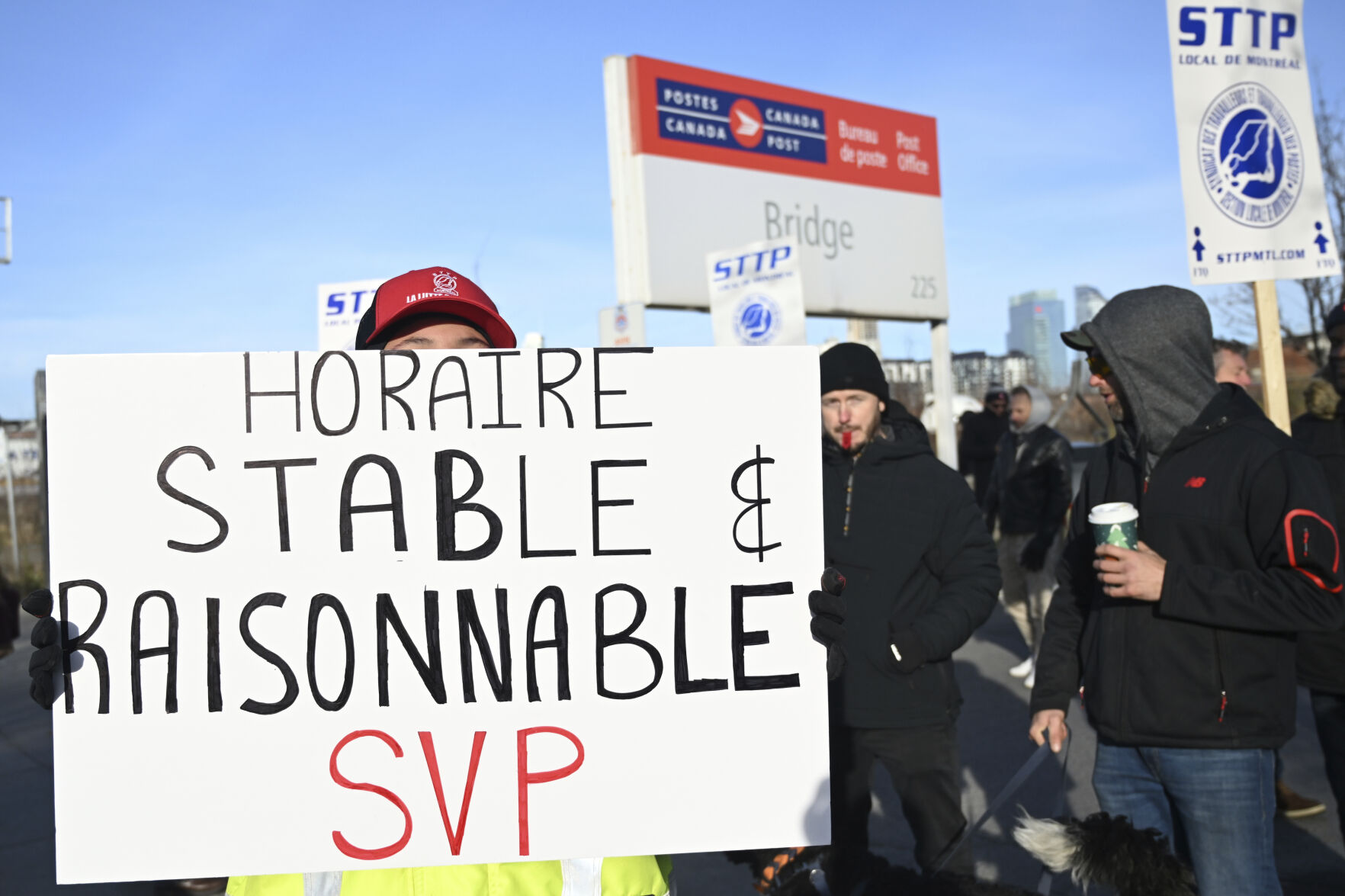 <p>Canada Post workers picket outside a sorting plant in Montreal on Friday, Nov.15, 2024. (Graham Hughes /The Canadian Press via AP)</p>   PHOTO CREDIT: Graham Hughes - foreign subscriber, ASSOCIATED PRESS