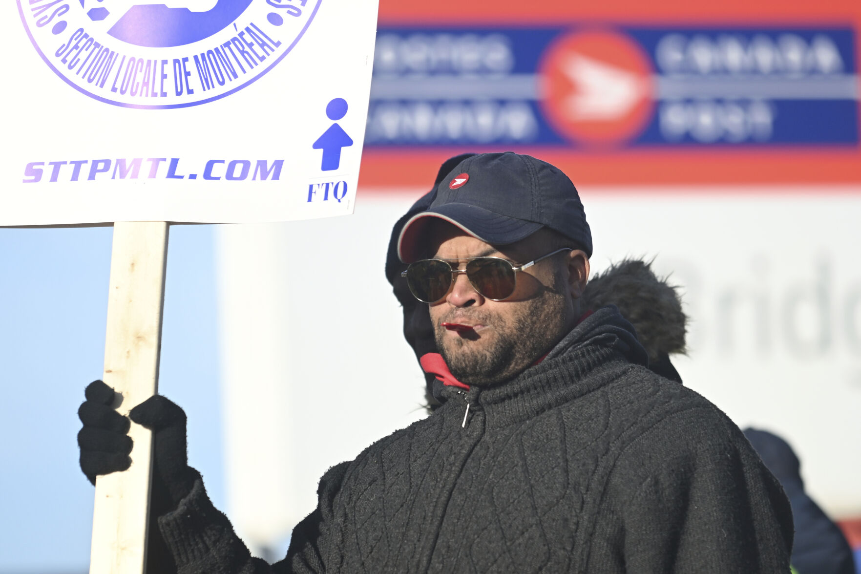 <p>Canada Post workers picket outside a sorting plant in Montreal on Friday, Nov.15, 2024. (Graham Hughes /The Canadian Press via AP)</p>   PHOTO CREDIT: Graham Hughes - foreign subscriber, ASSOCIATED PRESS