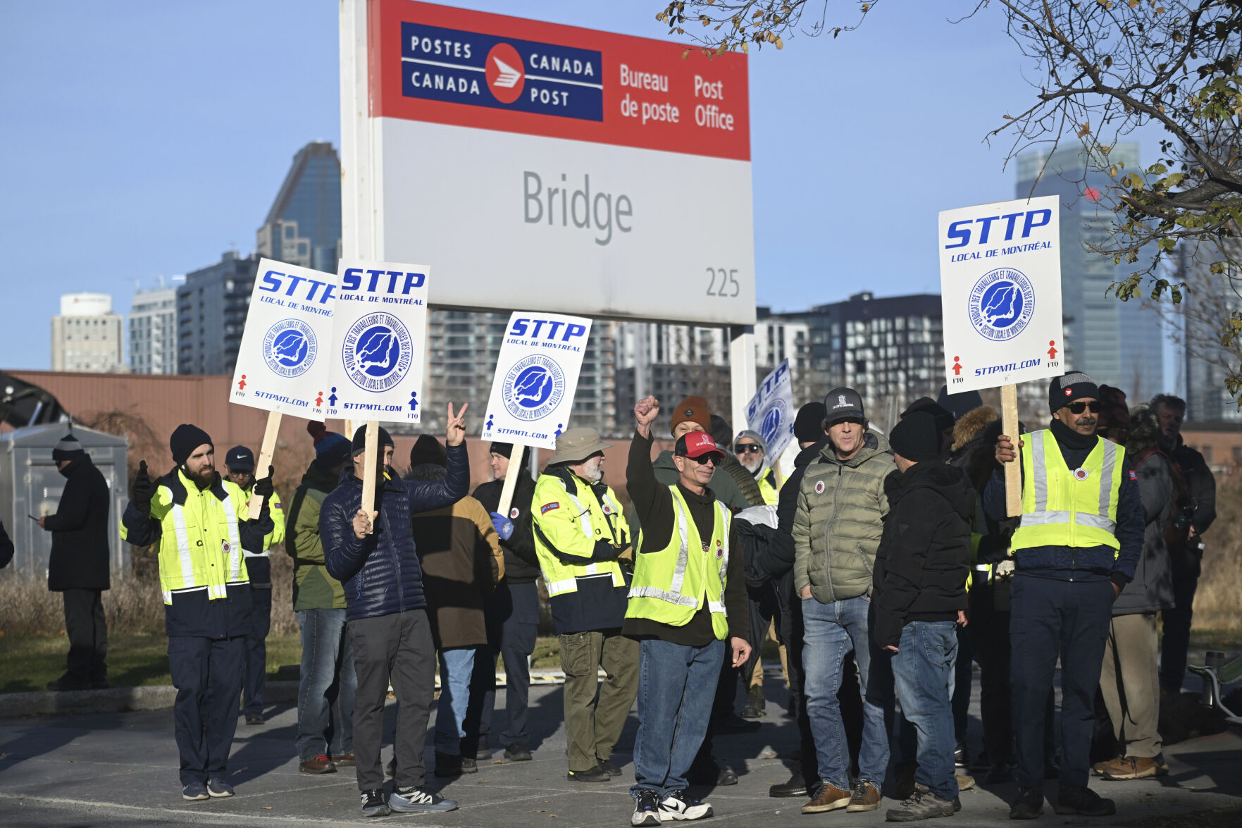 <p>Canada Post workers picket outside a sorting plant in Montreal on Friday, Nov.15, 2024. (Graham Hughes/The Canadian Press via AP)</p>   PHOTO CREDIT: Graham Hughes - foreign subscriber, ASSOCIATED PRESS