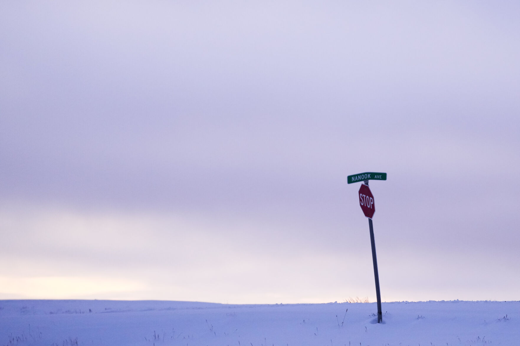 <p>FILE- A stop sign is seen on Nanook Ave., a word taken from the Inupiaq word for polar bear, in an undeveloped area at the edge of the village Monday, Oct. 14, 2024, in Kaktovik, Alaska. (AP Photo/Lindsey Wasson, File)</p>   PHOTO CREDIT: Lindsey Wasson - staff, ASSOCIATED PRESS