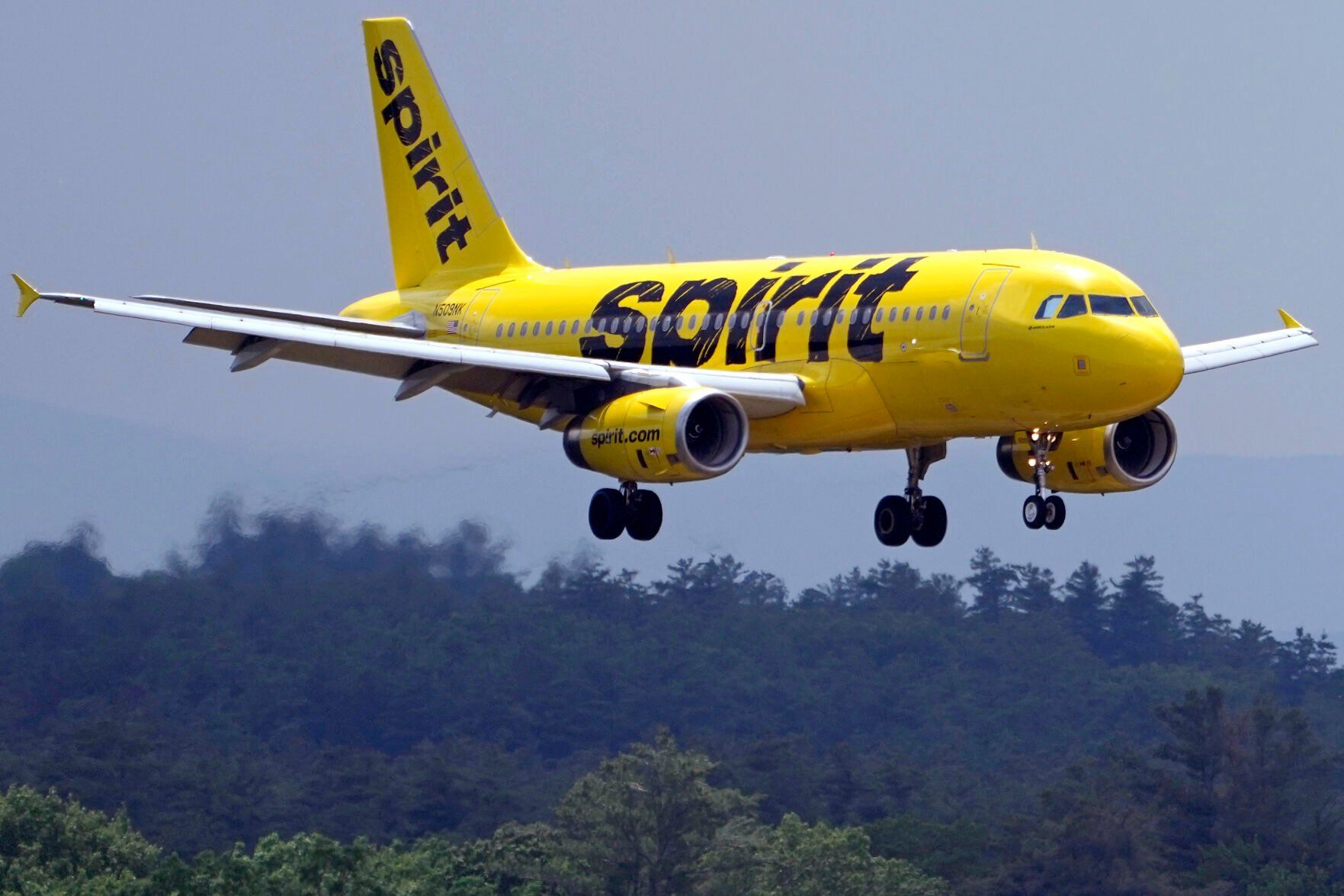 <p>FILE - A Spirit Airlines 319 Airbus approaches Manchester Boston Regional Airport for a landing, Friday, June 2, 2023, in Manchester, N.H. (AP Photo/Charles Krupa, File)</p>   PHOTO CREDIT: Charles Krupa