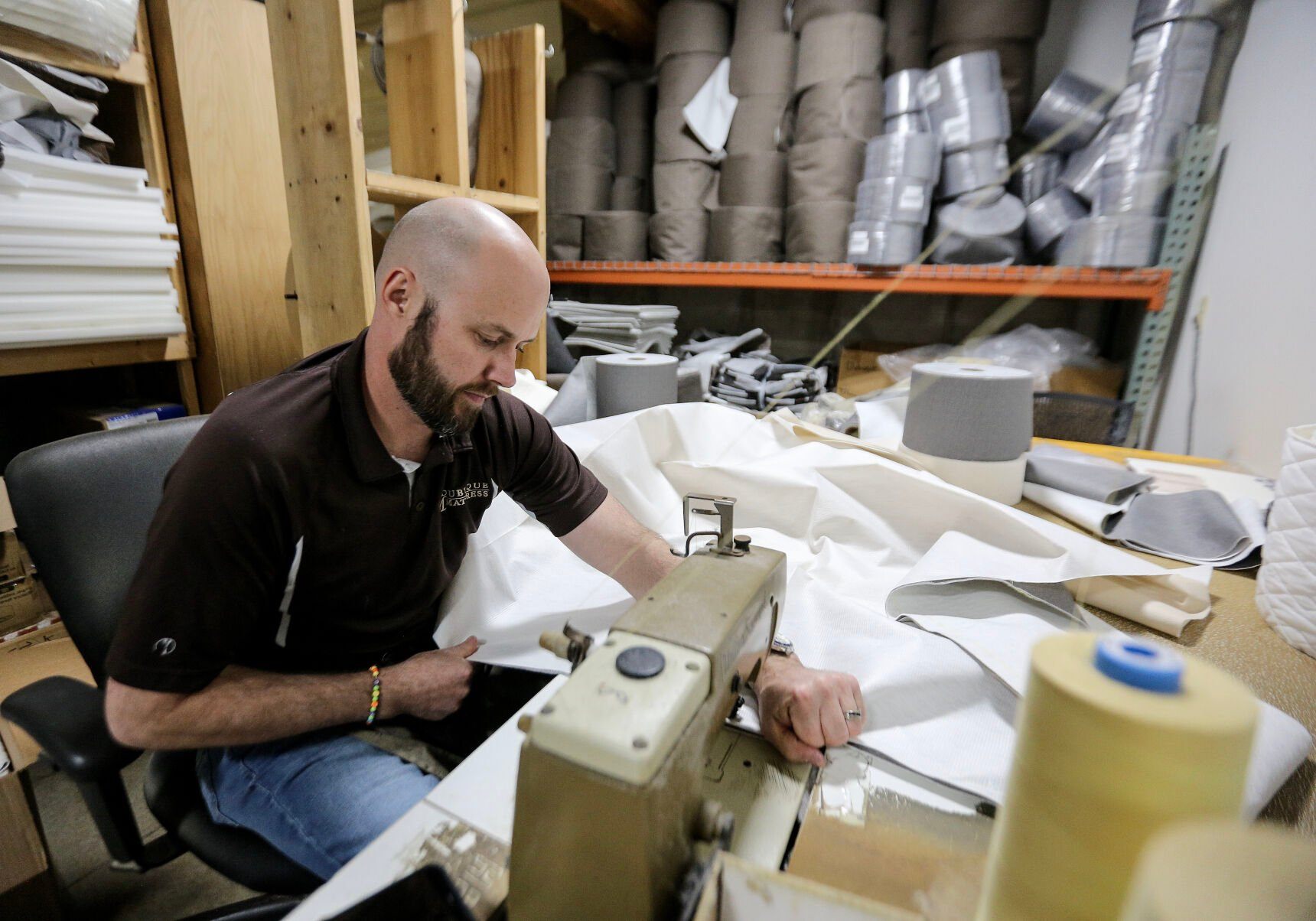 Jeremy Culbertson sews the top layers of a mattress at Dubuque Mattress Factory.    PHOTO CREDIT: Dave Kettering
Telegraph Herald