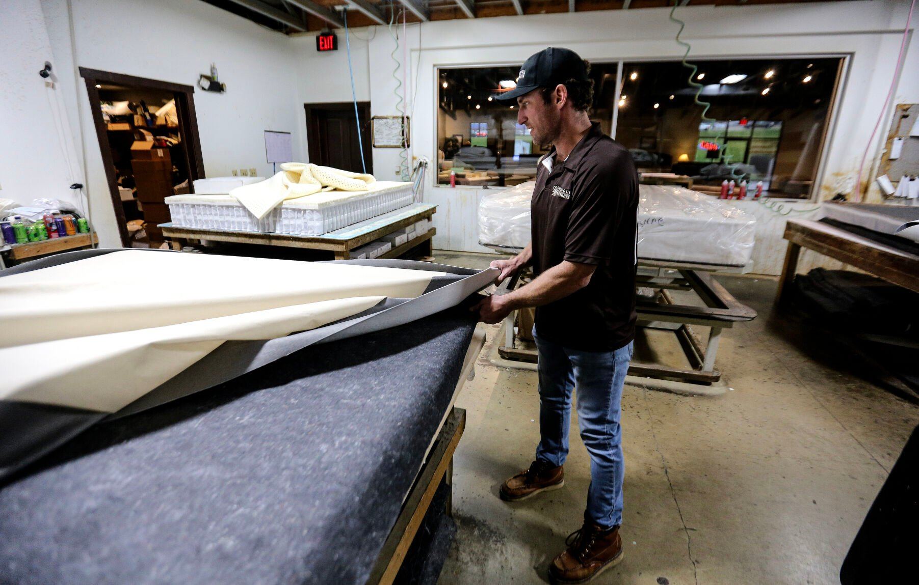 Jordan Sumners builds a custom mattress at Dubuque Mattress Factory.    PHOTO CREDIT: Dave Kettering
Telegraph Herald