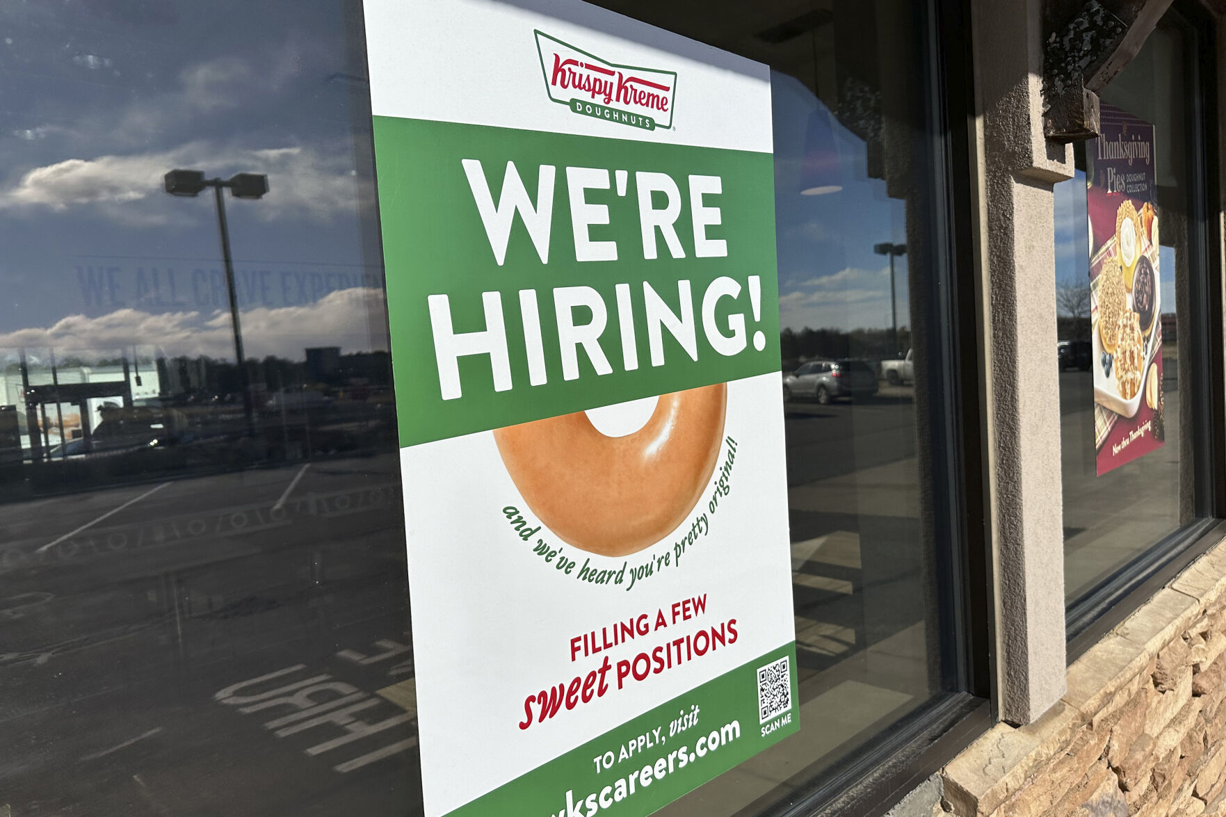 <p>FILE - A hiring sign is displayed in the window of a Krispy Kreme donut shop on Nov. 19, 2024, in Lone Tree, Colo. (AP Photo/David Zalubowski, File)</p>   PHOTO CREDIT: David Zalubowski - staff, ASSOCIATED PRESS