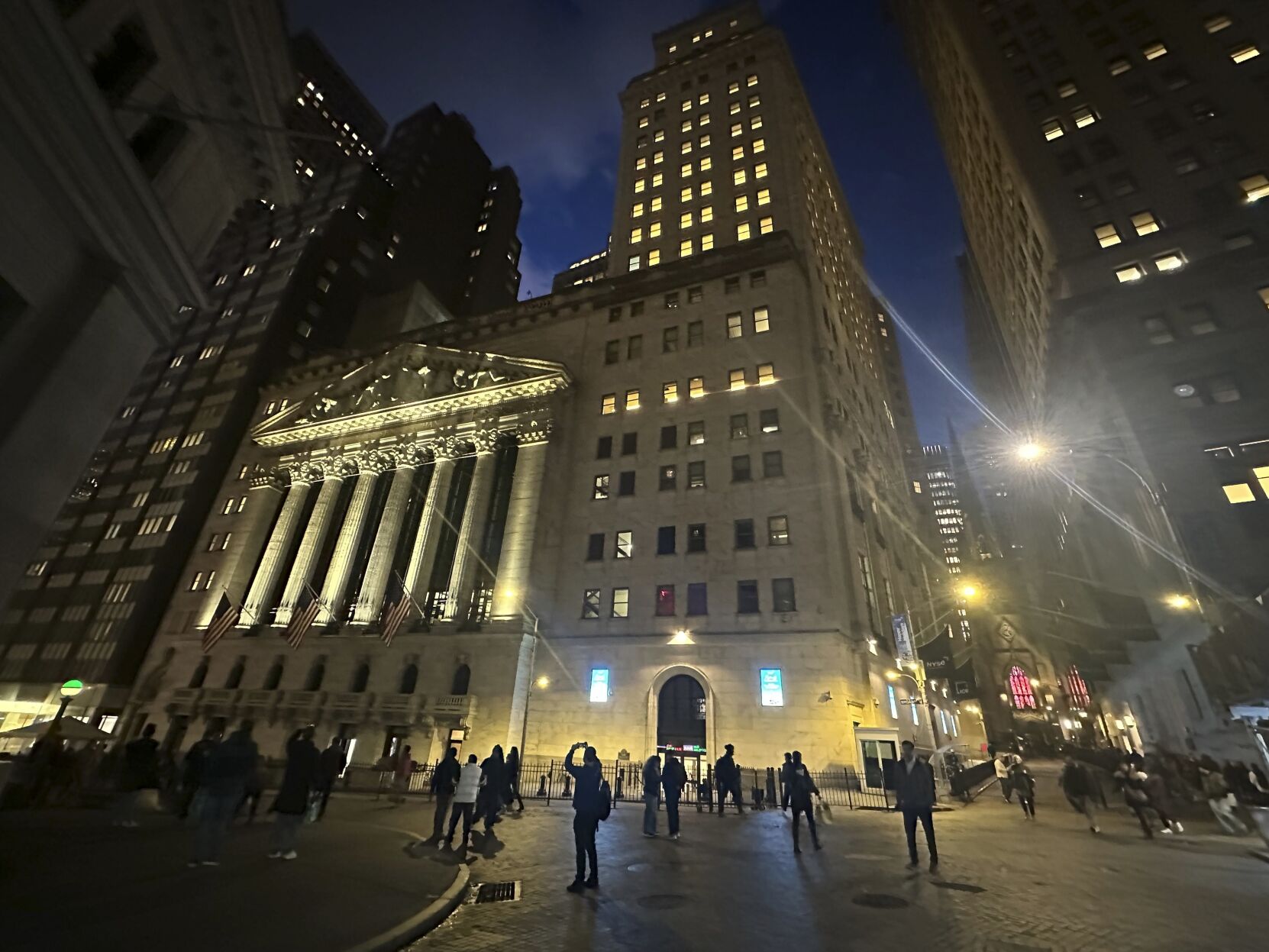 <p>FILE - People walk past the New York Stock Exchange on Tuesday, Nov. 26 2024. (AP Photo/Peter Morgan, File)</p>   PHOTO CREDIT: Peter Morgan - staff, ASSOCIATED PRESS