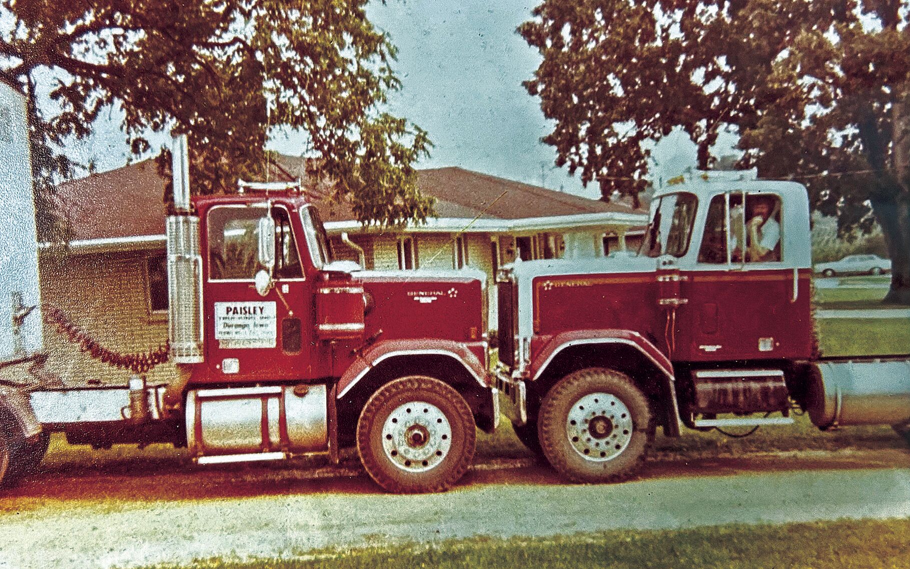 Gene Paisley sits in one of Paisley Trucking Company’s first trucks in the early 1980s. Paisley died in 2018.    PHOTO CREDIT: Contributed