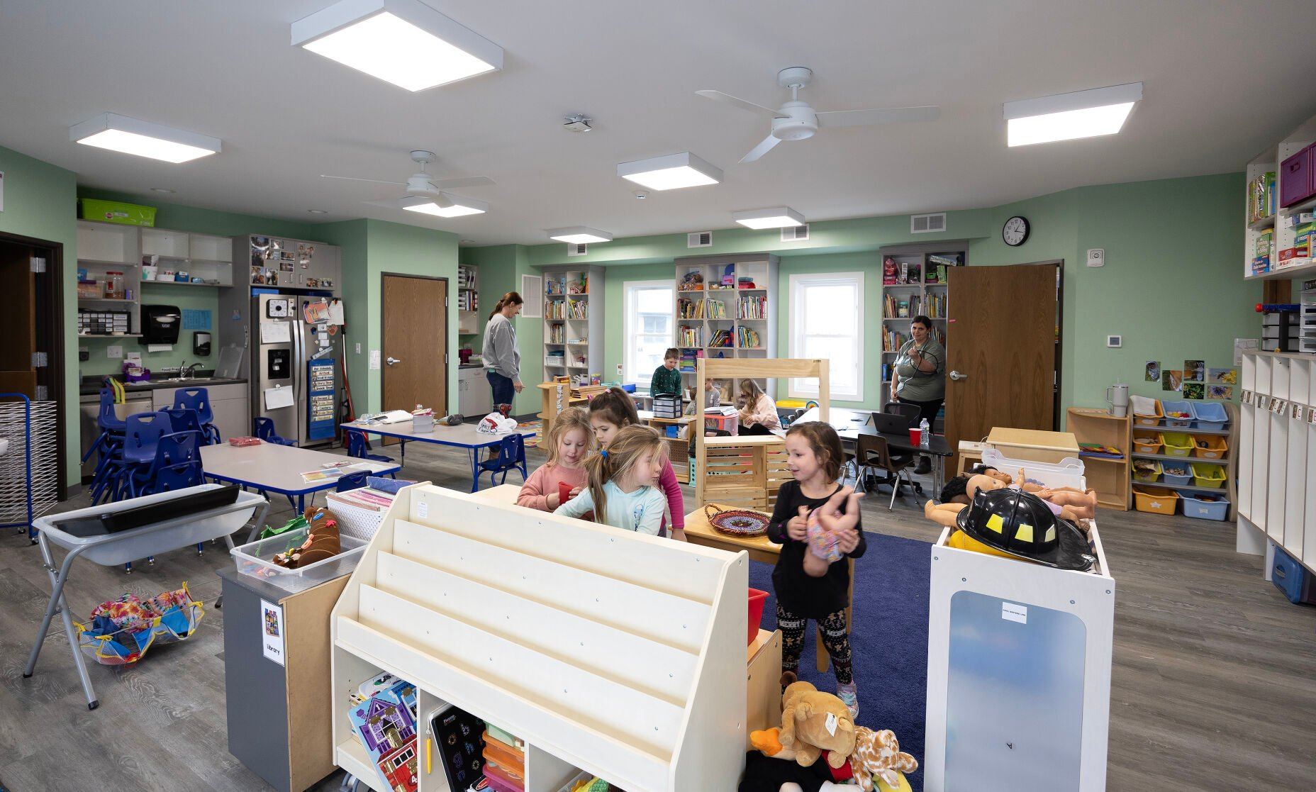 Children play in a classroom at Young-Uns Preschool and Childcare Center in Dubuque on Monday.    PHOTO CREDIT: Gassman