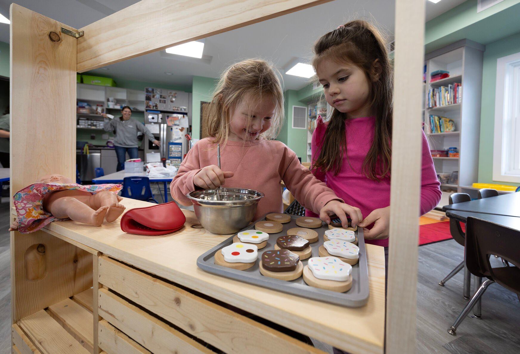 Eloise Flood, 4, and Sloane Schutz, 5, play in a classroom at Young-Uns Preschool and Childcare Center in Dubuque on Monday.    PHOTO CREDIT: Gassman