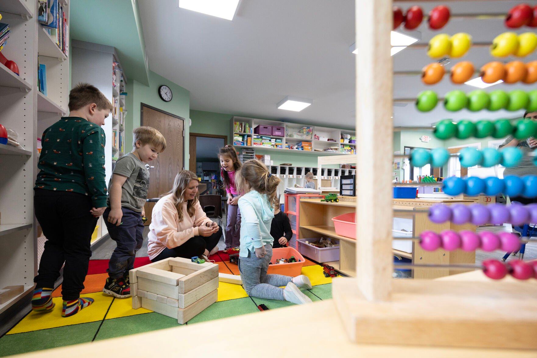 Playtime is held in a classroom at Young-Uns Preschool and Childcare Center in Dubuque on Monday.    PHOTO CREDIT: Stephen Gassman