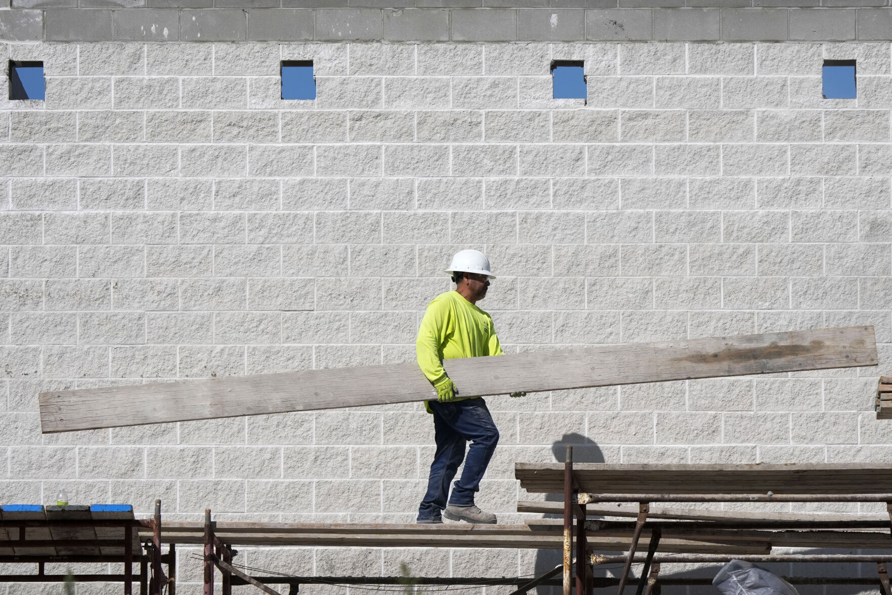 <p>FILE - A construction worker walks on scaffolding at a building site on Sept. 4, 2024, in Waukee, Iowa. (AP Photo/Charlie Neibergall, File)</p>   PHOTO CREDIT: Charlie Neibergall - staff, ASSOCIATED PRESS