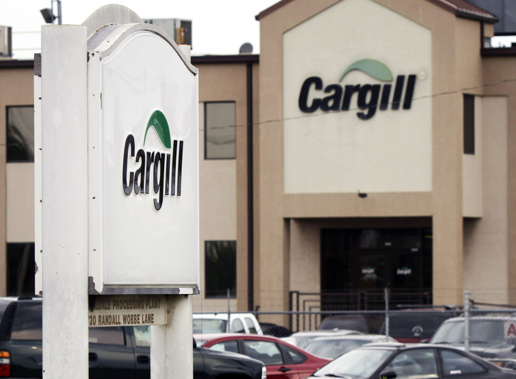 <p>FILE - Cars sit parked at a Cargill Inc., turkey processing plant on Aug. 4, 2011, in Springdale, Ark. (AP Photo/Danny Johnston, File)</p>   PHOTO CREDIT: Danny Johnston - staff, ASSOCIATED PRESS