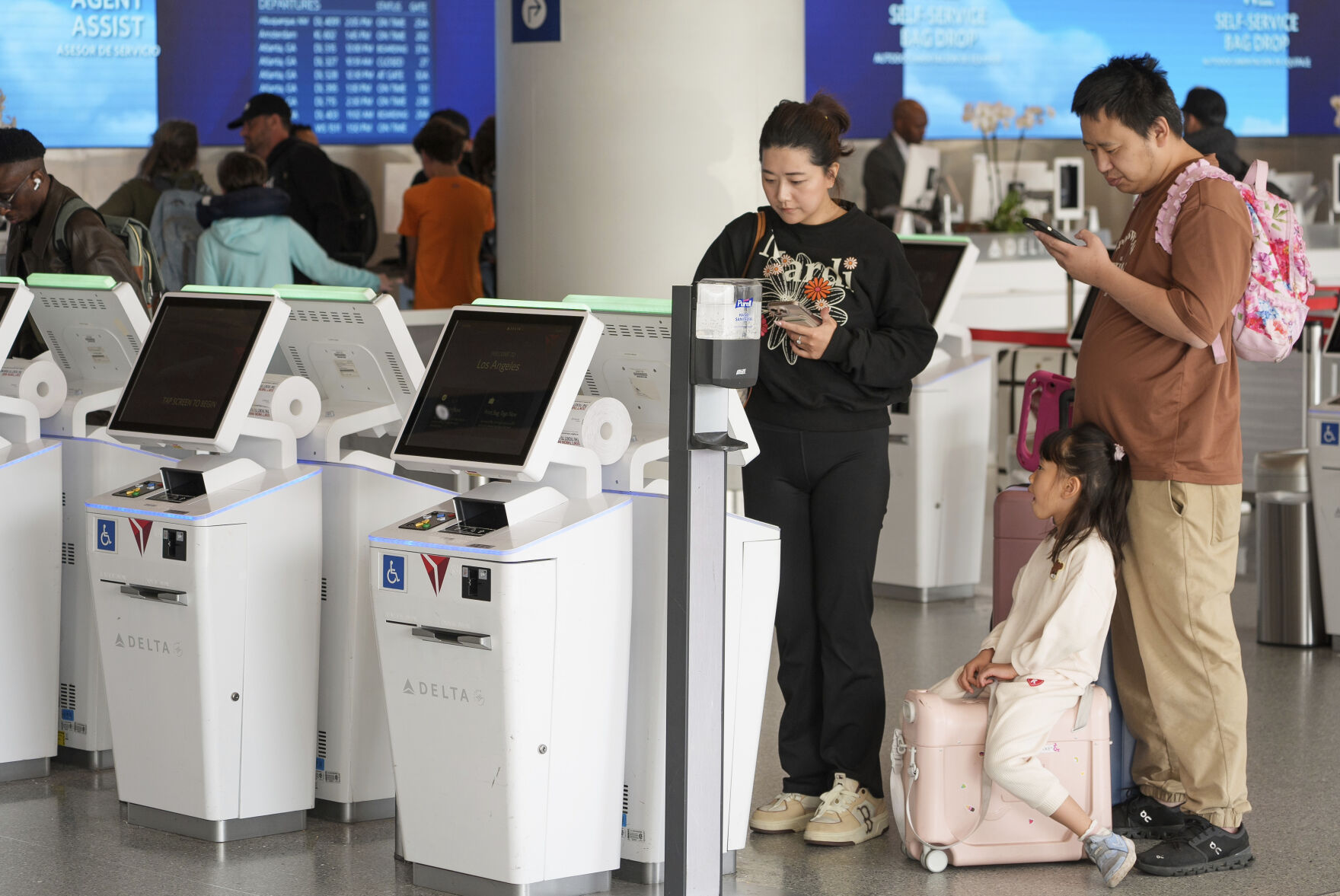 <p>Travelers self-check at Delta Airlines counter at Los Angeles International Airport in Los Angeles, Wednesday, Nov. 27, 2024. (AP Photo/Damian Dovarganes)</p>   PHOTO CREDIT: Damian Dovarganes - staff, ASSOCIATED PRESS