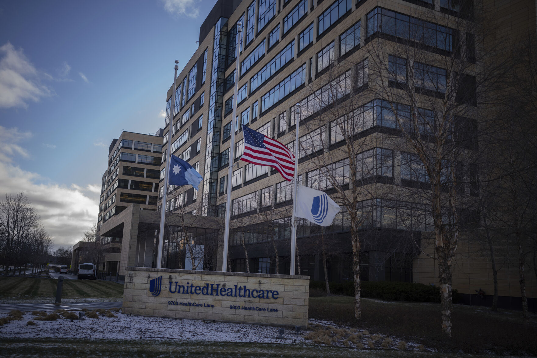 <p>Flags fly at half mast in front of UnitedHealthcare headquarters in Minnetonka, Minn., Wednesday Dec. 4, 2024, after its CEO Brian Thompson was shot and killed in New York City. (Jerry Holt/Star Tribune via AP)</p>   PHOTO CREDIT: Jerry Holt - member, ASSOCIATED PRESS