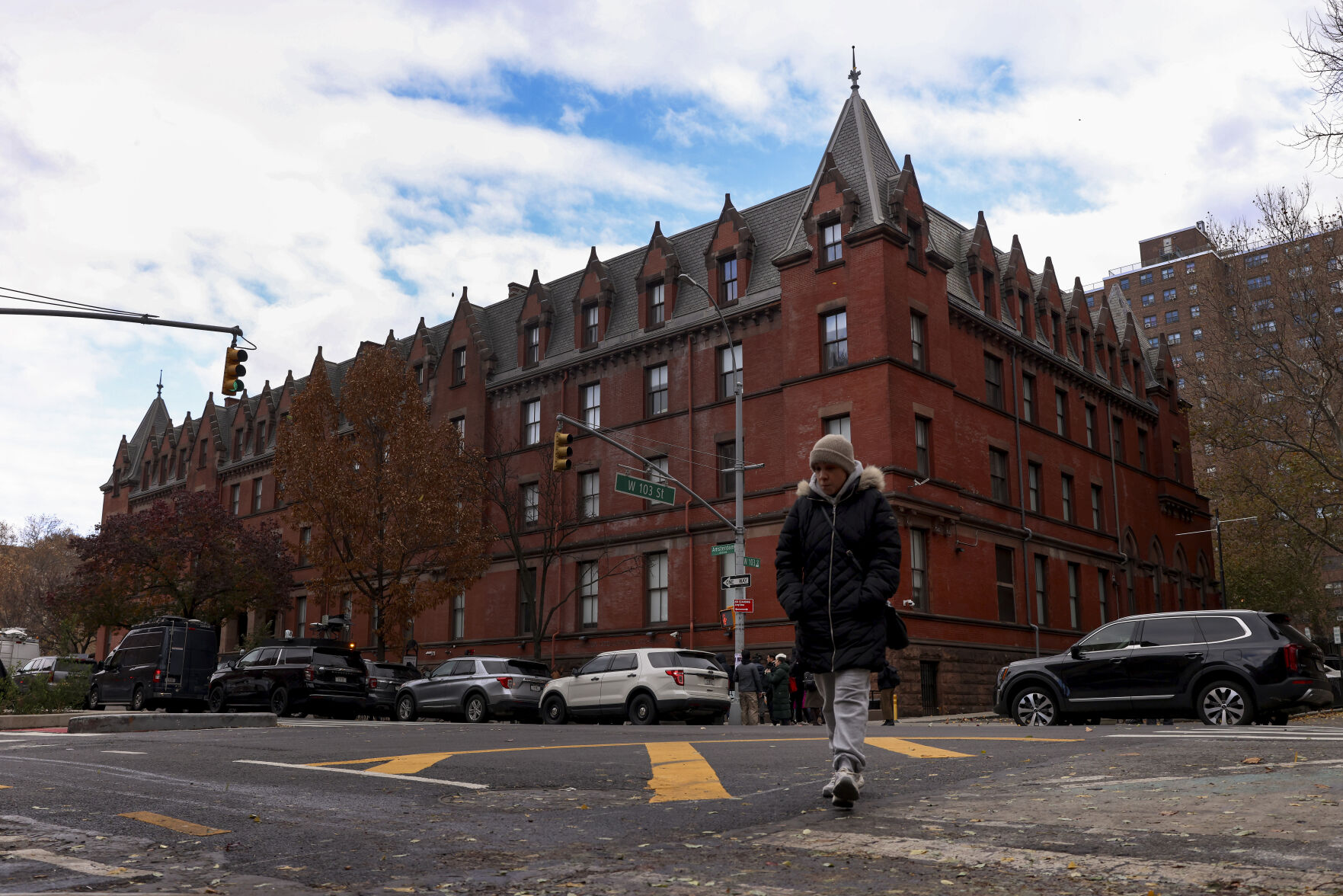 <p>A woman crosses Amsterdam Avenue outside the HI New York City hostel, Thursday, Dec. 5, 2024, in New York, where police say the suspect in the killing of UnitedHealthcare CEO Brian Thompson may have stayed.(AP Photo/Yuki Iwamura)</p>   PHOTO CREDIT: Yuki Iwamura - freelancer, ASSOCIATED PRESS