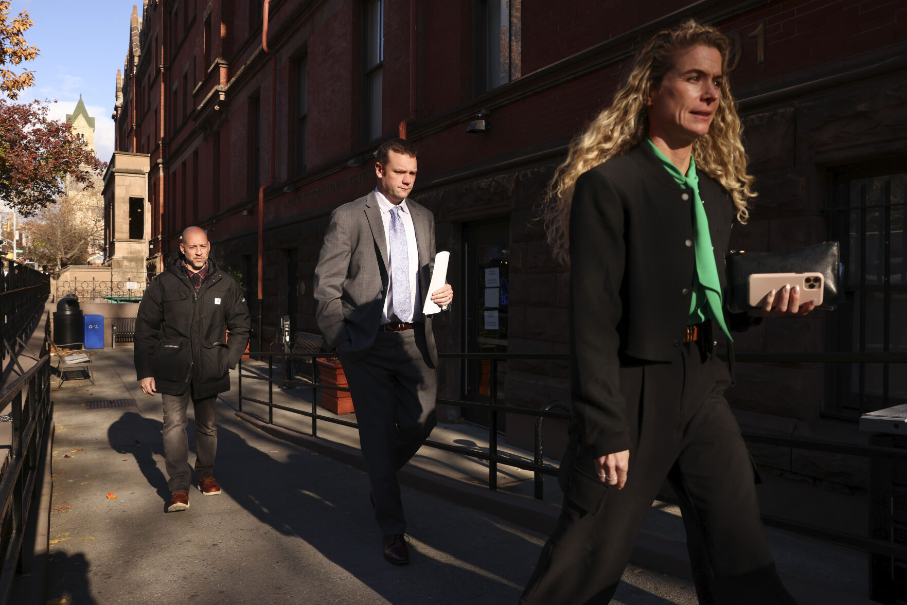 <p>New York Police investigators exit the HI New York City Hostel, Thursday, Dec. 5, 2024, in New York, where police say the suspect in the killing of UnitedHealthcare CEO Brian Thompson may have stayed. (AP Photo/Yuki Iwamura)</p>   PHOTO CREDIT: Yuki Iwamura - freelancer, ASSOCIATED PRESS