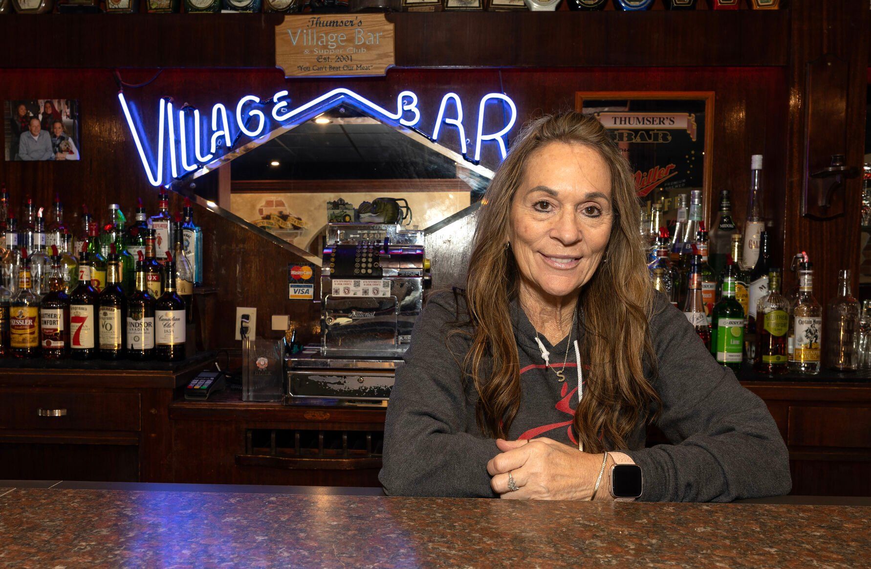 Co-owner Shelly Thumser stands behind the bar at Village Bar Supper Club in Kieler, Wis., on Monday. 