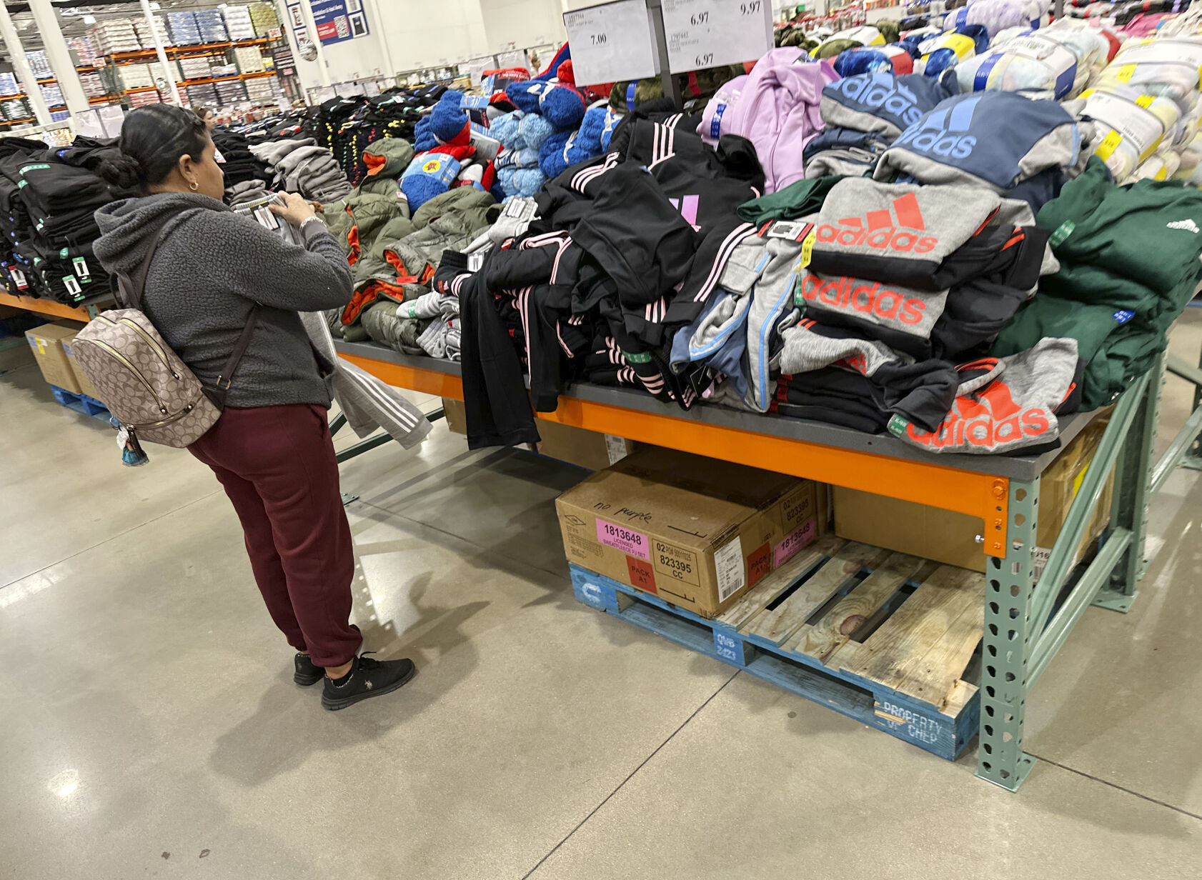 <p>A shopper looks over clothing on display in a Costco warehouse Wednesday, Dec. 4, 2024, in Sheridan, Colo. (AP Photo/David Zalubowski)</p>   PHOTO CREDIT: David Zalubowski - staff, ASSOCIATED PRESS