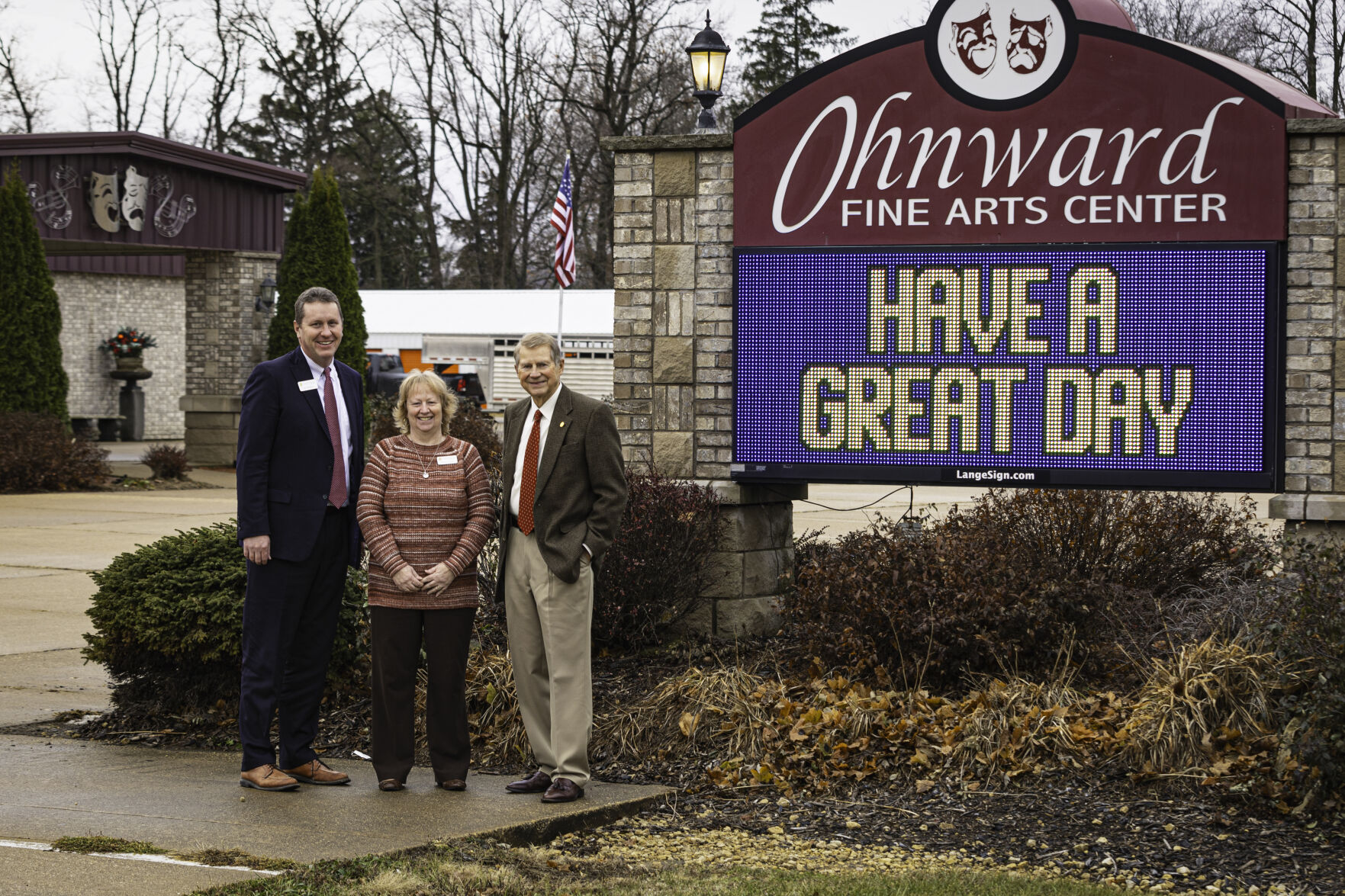 Al Tubbs, chairman of Ohnward Bancshares, stands by Ohnward Fine Arts Center’s monument sign with Maquoketa State Bank President and CEO Leo McGarry and Executive Vice President of Cashiers Wendy Zaruba.    PHOTO CREDIT: Thomas Eckermann