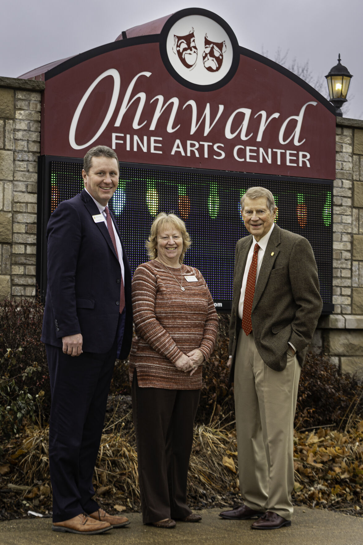 Al Tubbs, chairman of Ohnward Bancshares, stands by Ohnward Fine Arts Center’s monument sign with Maquoketa State Bank President and CEO Leo McGarry and Executive Vice President of Cashiers Wendy Zaruba.    PHOTO CREDIT: Thomas Eckermann