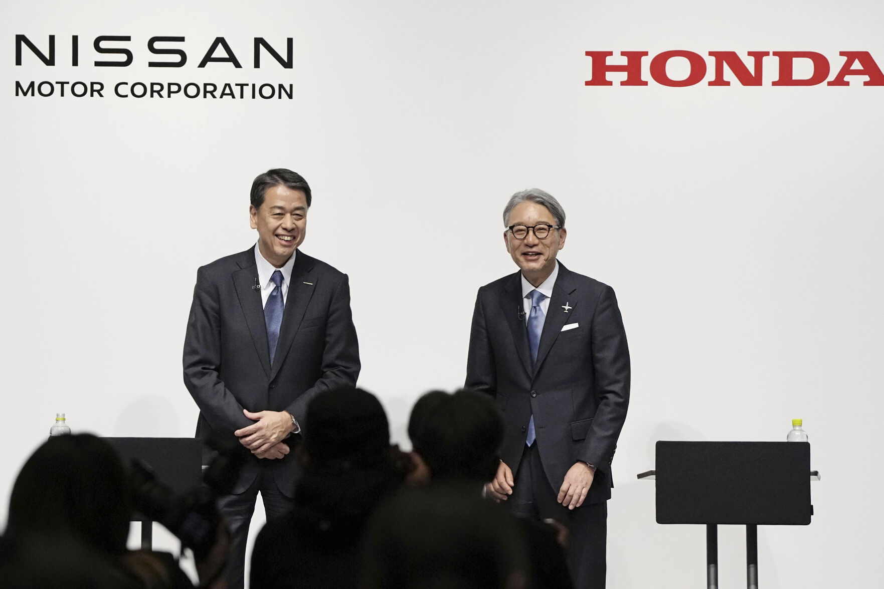 <p>FILE - Nissan Chief Executive Makoto Uchida, left, and Honda President Toshihiro Mibe attend a joint news conference in Tokyo, Friday, March 15, 2024. (Kyodo News via AP, File)</p>   PHOTO CREDIT: Kyodo News via AP