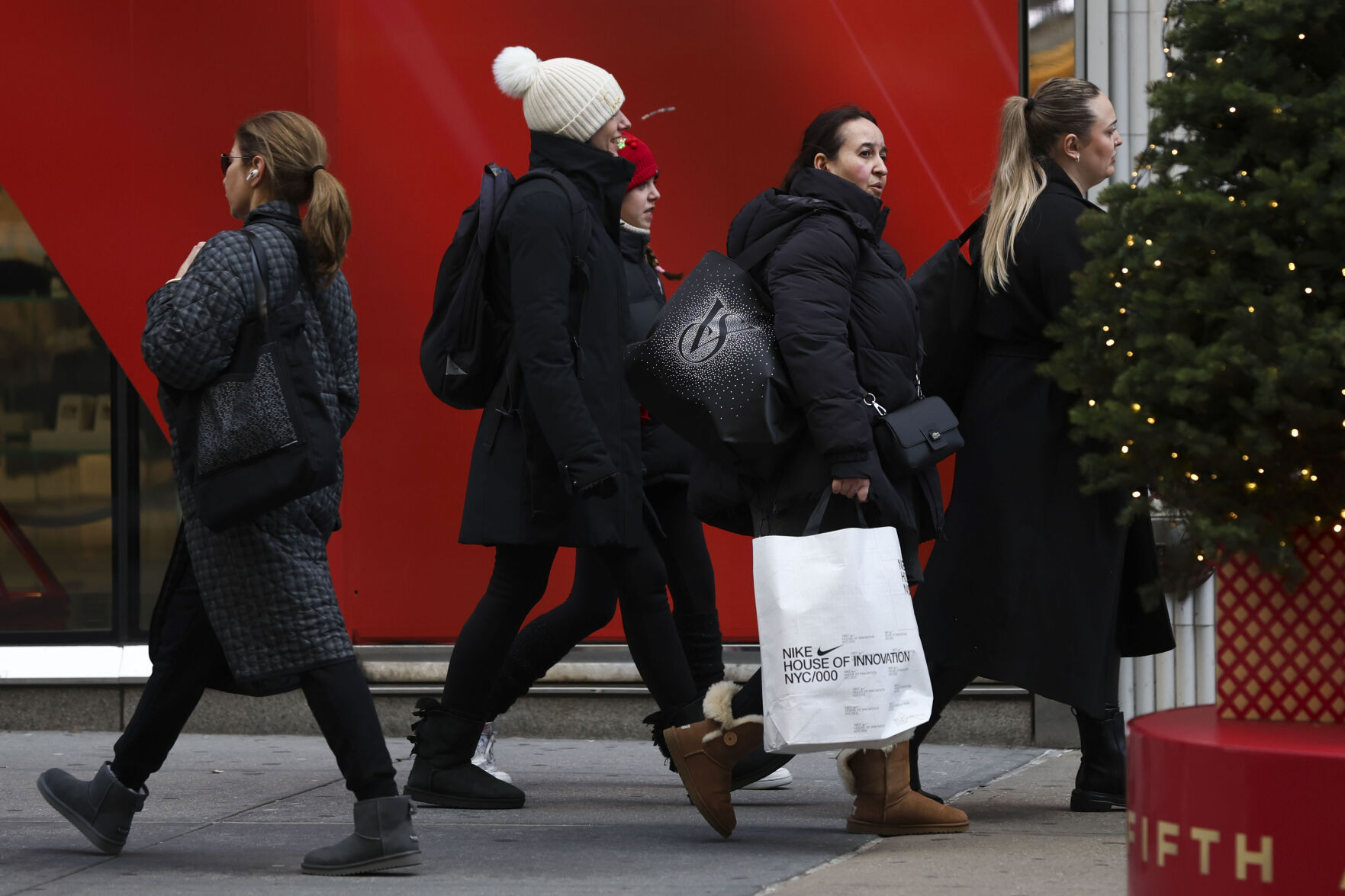 <p>FILE - Shoppers walk along Fifth Avenue on Nov. 29, 2024, in New York. (AP Photo/Heather Khalifa, File)</p>   PHOTO CREDIT: Heather Khalifa 