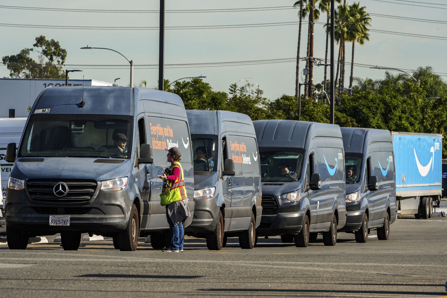 <p>Amazon drivers wait in line before departing to deliver goods as Amazon workers picket outside the gates of an Amazon Fulfillment Center, Thursday, Dec. 19, 2024, in City of Industry, Calif. (AP Photo/Damian Dovarganes)</p>   PHOTO CREDIT: Damian Dovarganes - staff, ASSOCIATED PRESS