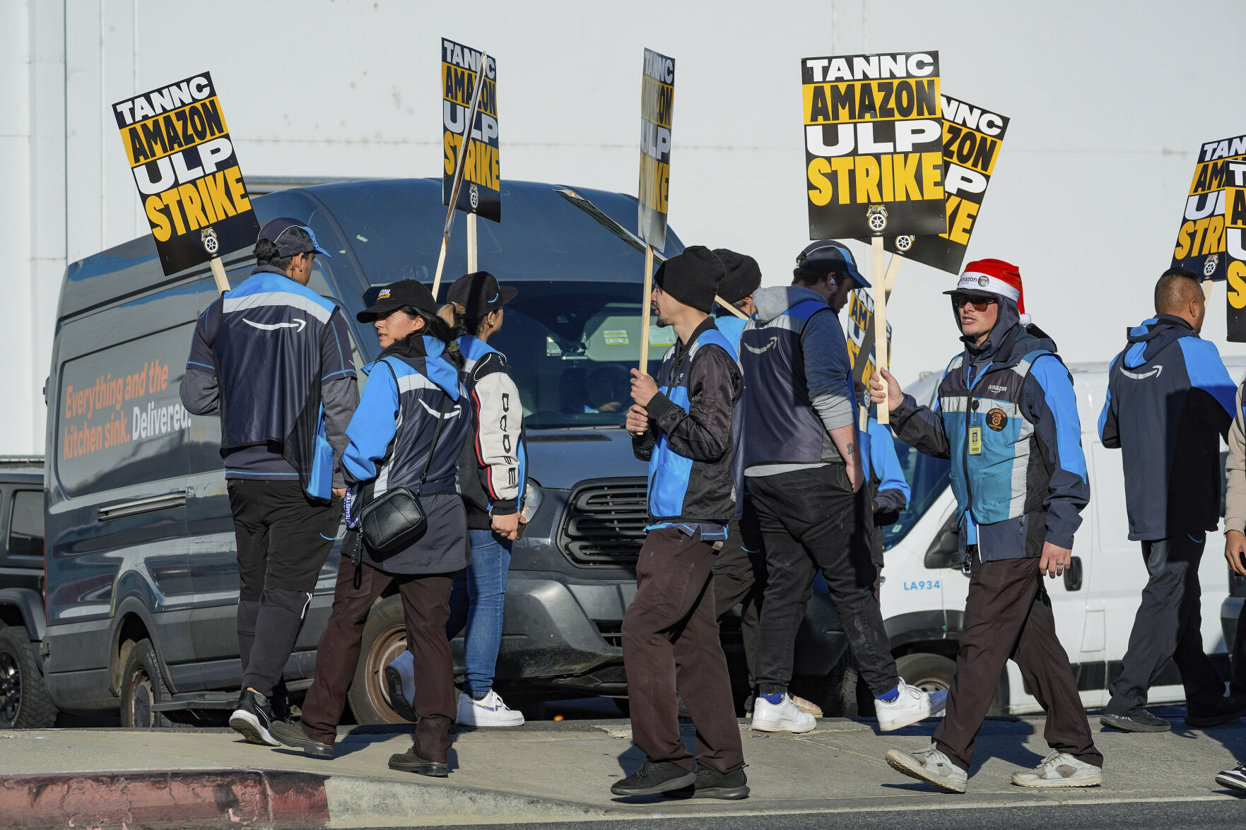 <p>Amazon workers strike outside the gates of an Amazon Fulfillment Center as Teamsters seek labor contract nationwide Thursday, Dec. 19, 2024, in City of Industry, Calif. (AP Photo/Damian Dovarganes)</p>   PHOTO CREDIT: Damian Dovarganes - staff, ASSOCIATED PRESS