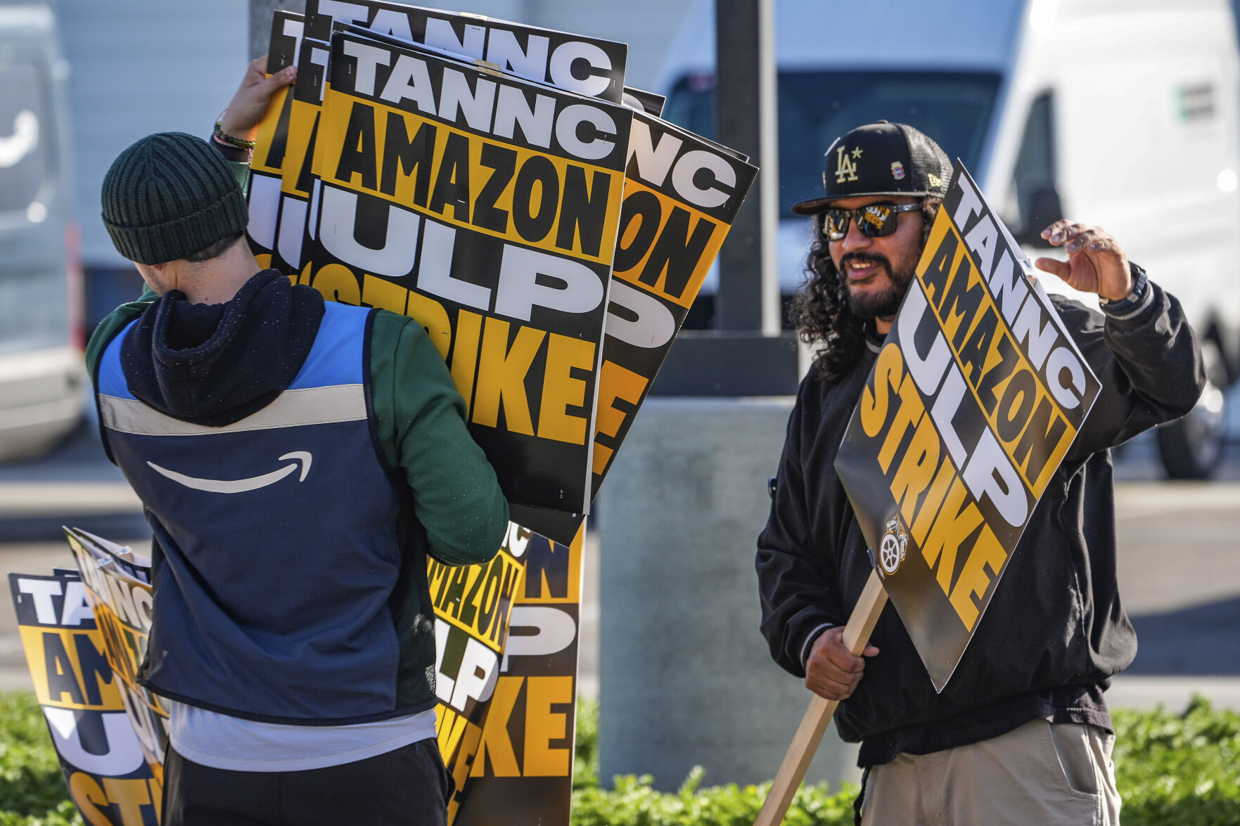 <p>Amazon workers strike outside the gates of an Amazon Fulfillment Center as Teamsters seek labor contract nationwide, Thursday, Dec. 19, 2024, in City of Industry, Calif. (AP Photo/Damian Dovarganes)</p>   PHOTO CREDIT: Damian Dovarganes - staff, ASSOCIATED PRESS