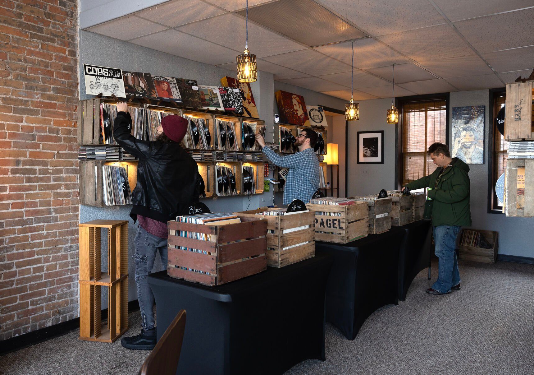 Customers browse through vinyl records on Friday at Ruix Records.    PHOTO CREDIT: Gassman