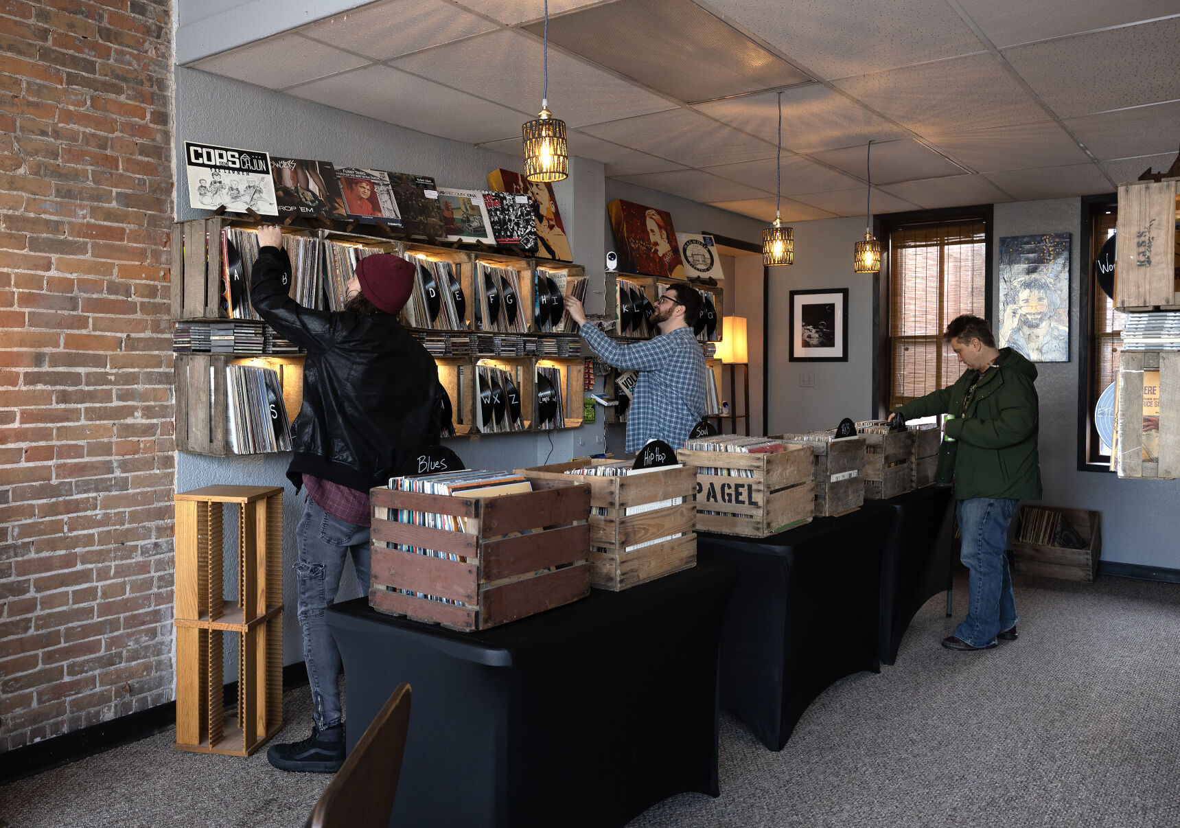 Customers browse through the vinyl records on Friday.    PHOTO CREDIT: Gassman