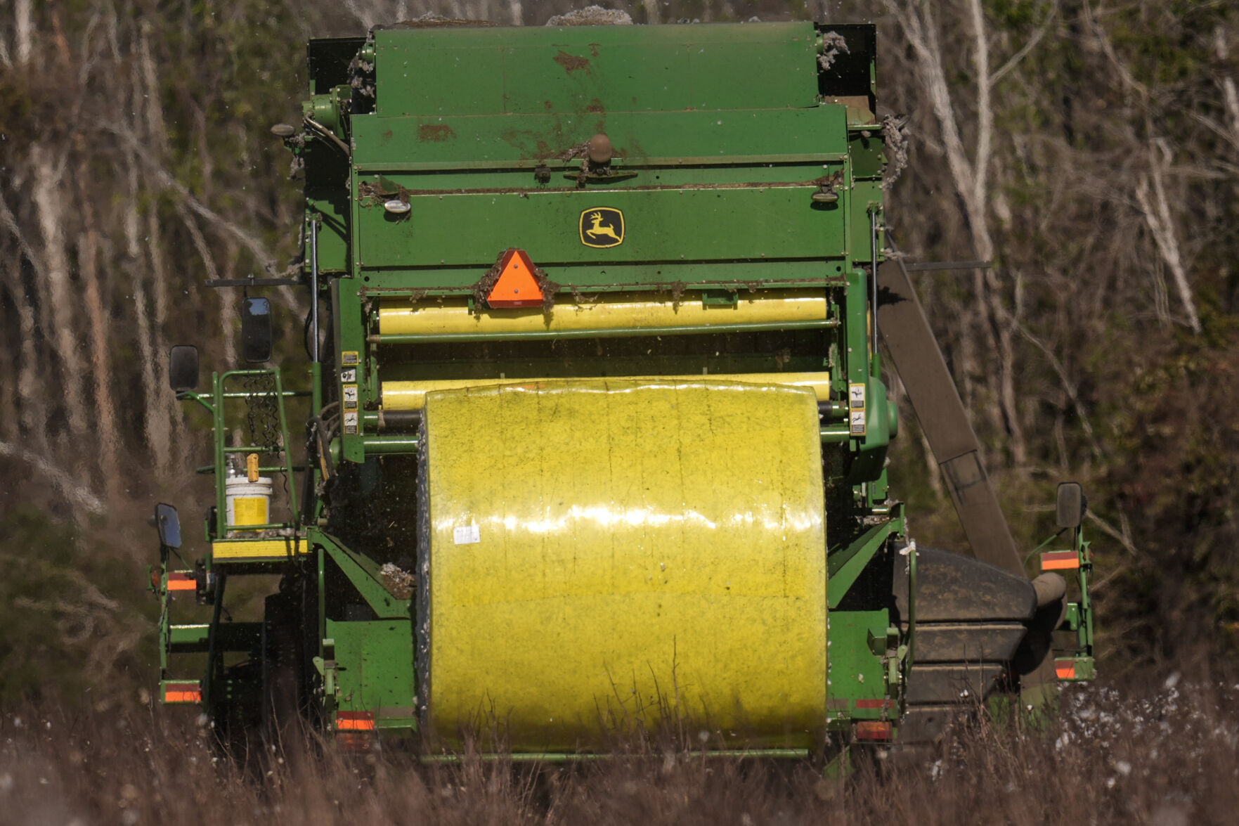 <p>The cotton picker produced a large round bale of picked cotton, Friday, Dec. 6, 2024, near Lyons, Ga. (AP Photo/Mike Stewart)</p>   PHOTO CREDIT: Mike Stewart - staff, ASSOCIATED PRESS