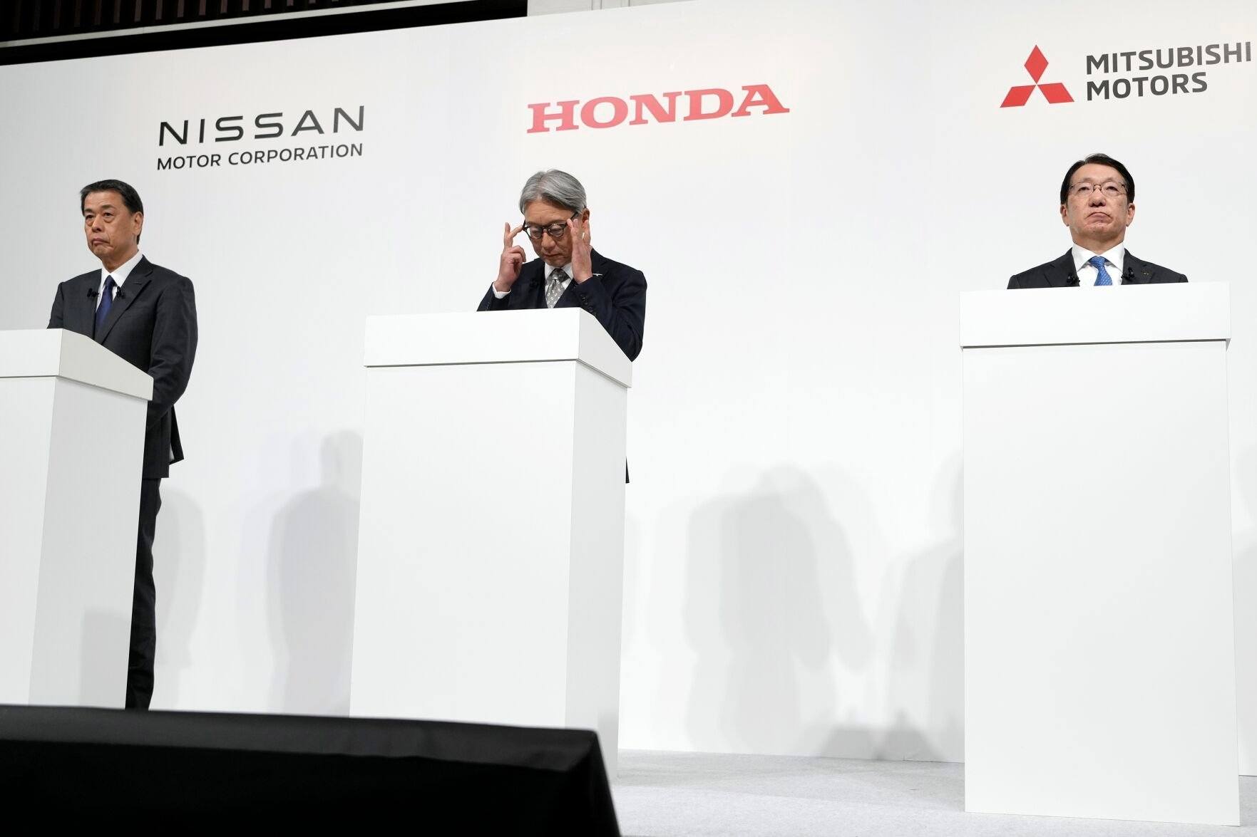 <p>Nissan Chief Executive Makoto Uchida, left, and Honda Chief Executive Toshihiro Mibe, center, and Takao Kato CEO of Mitsubishi Motors, right, attend a joint news conference Monday, Dec. 23, 2024, in Tokyo, Japan. (AP Photo/Eugene Hoshiko)</p>   PHOTO CREDIT: Eugene Hoshiko 