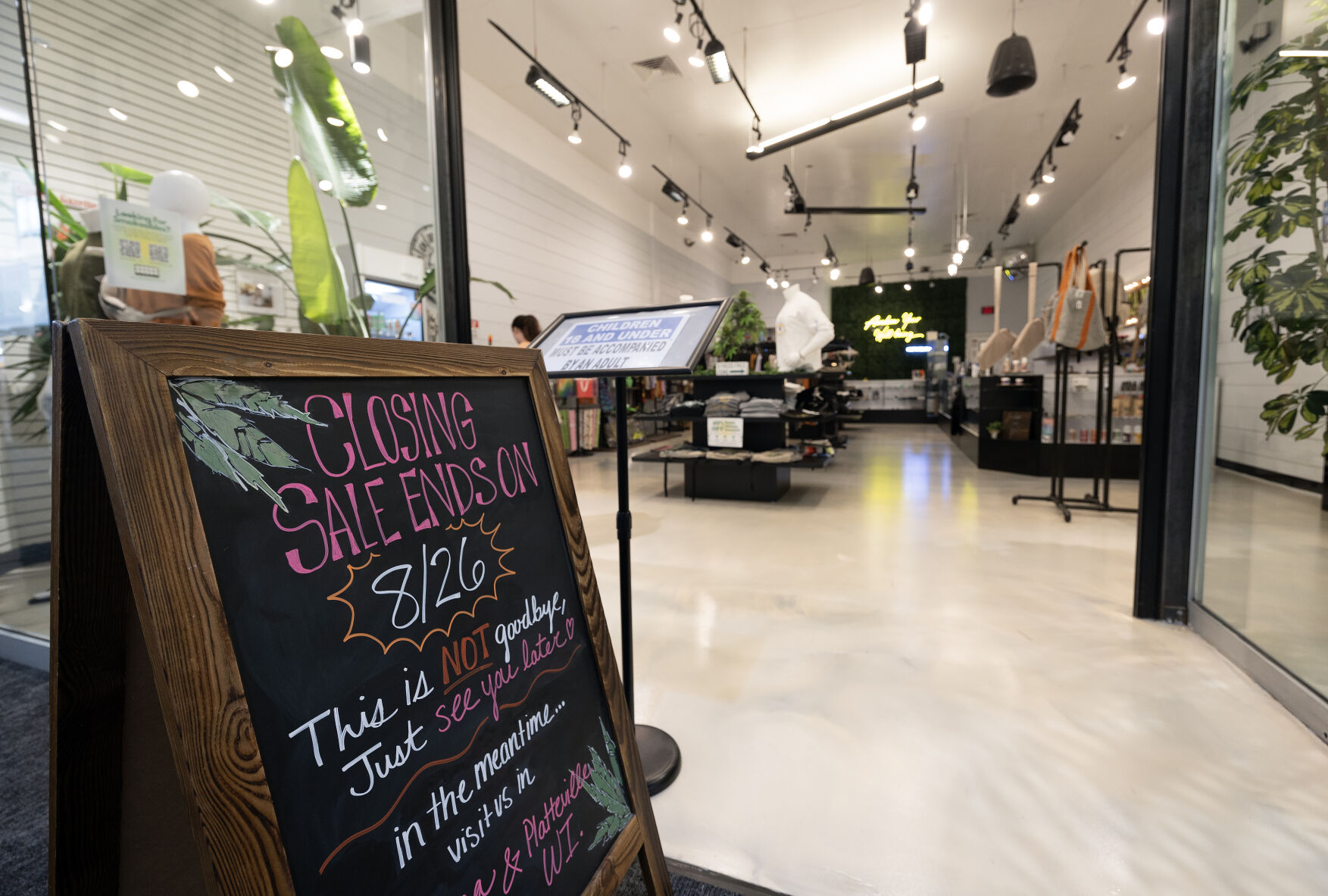 A “store closing” sign in front of Botanicanna inside Kennedy Mall in Dubuque in August.    PHOTO CREDIT: TH file