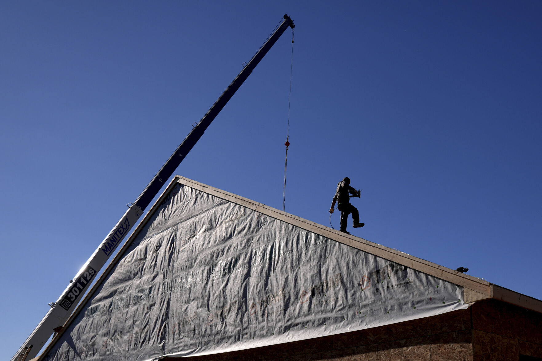 <p>FILE - Construction workers frame a new single-family home on Dec. 6, 2024, in Owensboro, Ky. (AP Photo/Charlie Riedel)</p>   PHOTO CREDIT: Charlie Riedel - staff, ASSOCIATED PRESS