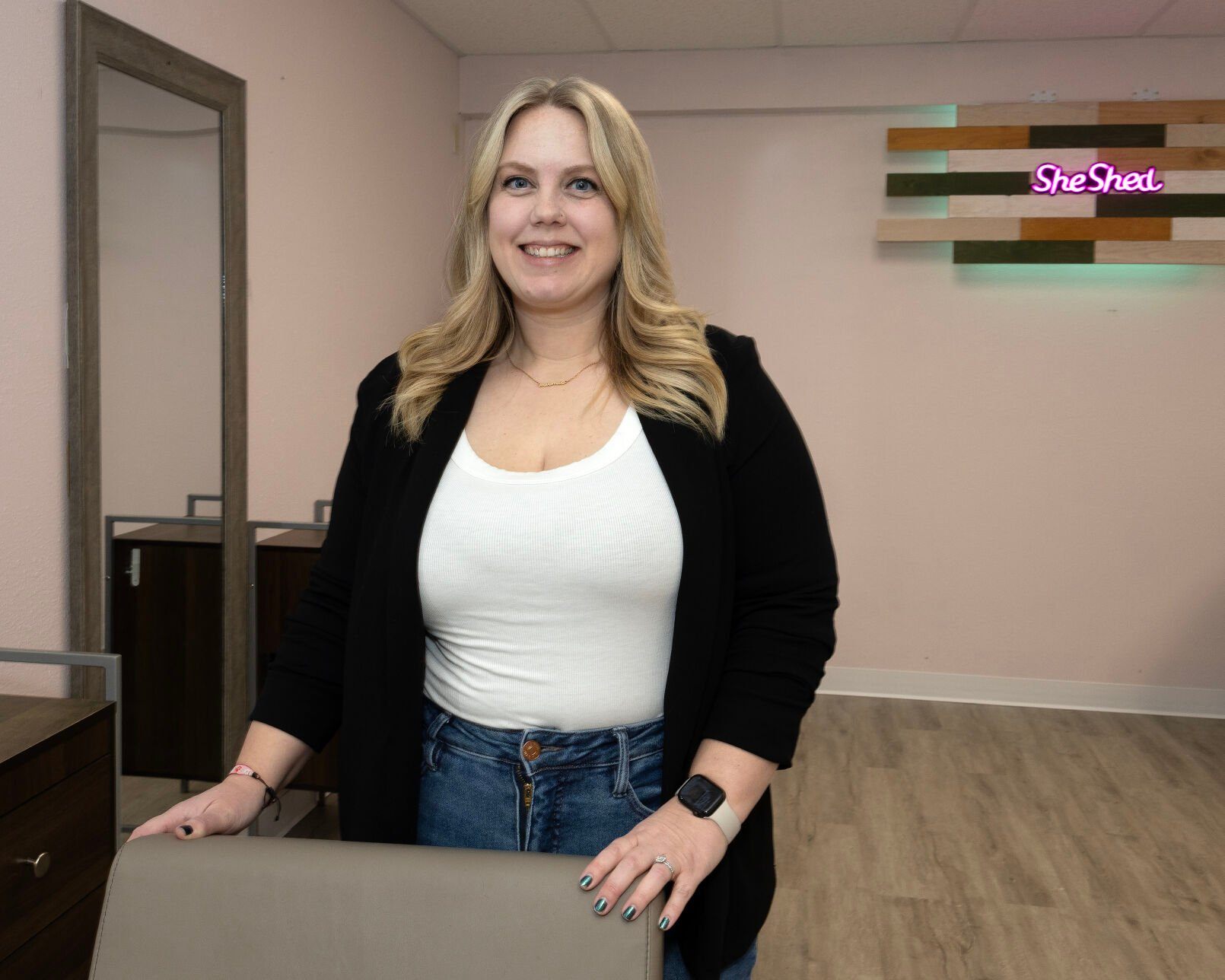 Owner Heather Oehlerking poses at She Shed Hair Shop in Peosta, Iowa, on Friday, Dec. 27, 2024.    PHOTO CREDIT: Stephen Gassman