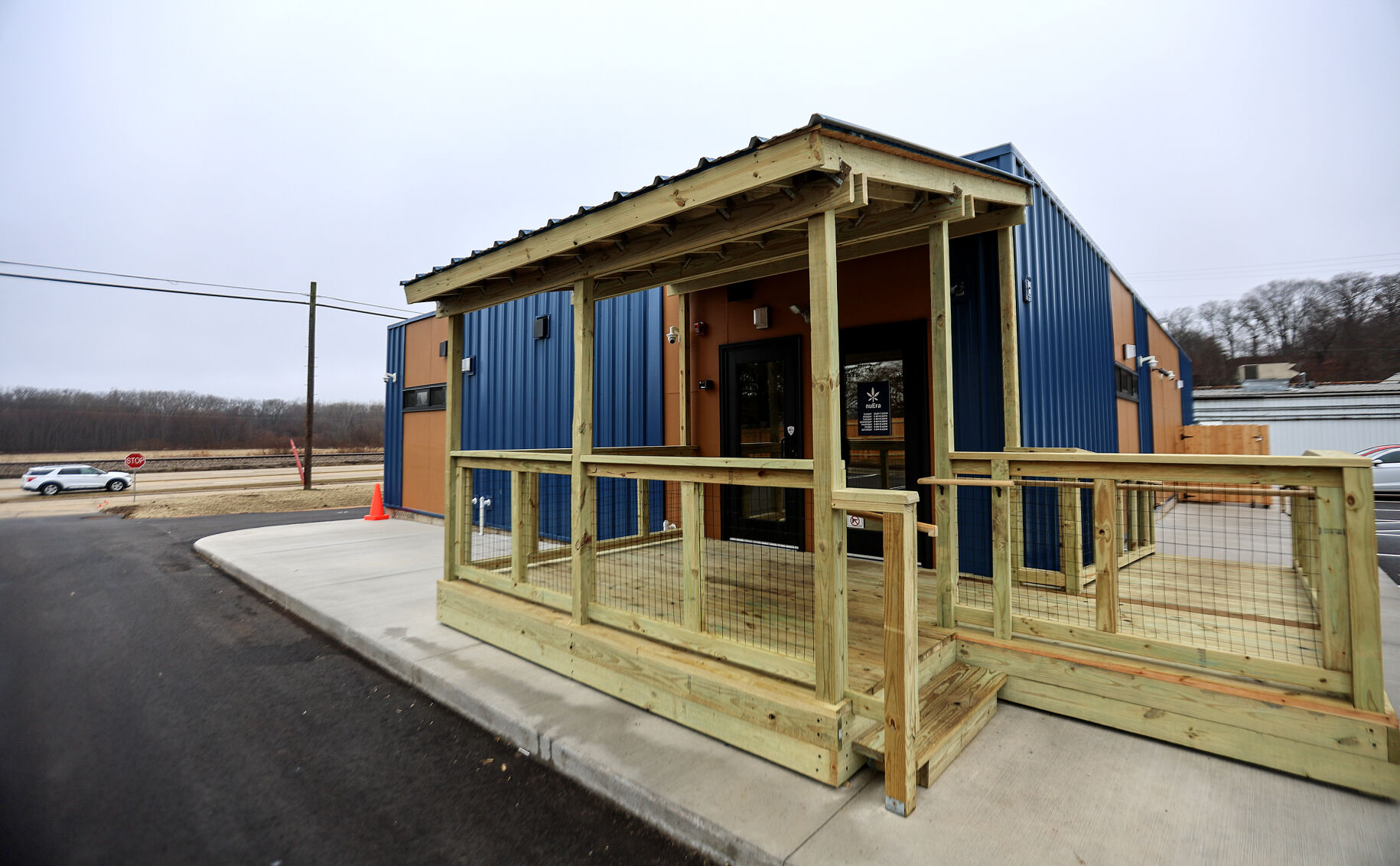 Exterior view of nuEra Cannabis located next to Family Beer and Liquor Store in East Dubuque, Ill., on Monday, Dec. 30, 2024.    PHOTO CREDIT: Dave Kettering