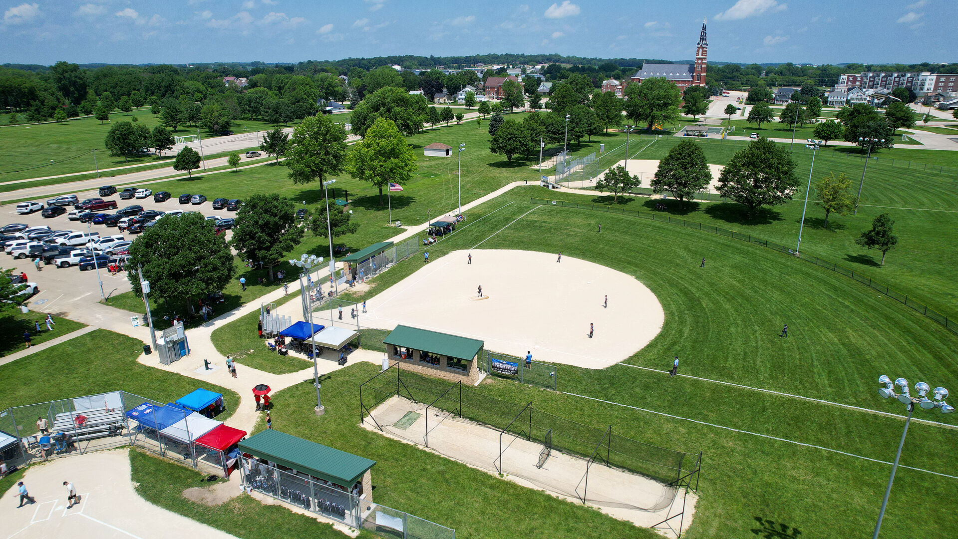 Kids take the field during the Field of Dreams baseball tournament held at Westside Park in Dyersville, Iowa, in June. Dyersville hopes to attract more teams to tournaments this year.    PHOTO CREDIT: Dave Kettering 
Telegraph Herald