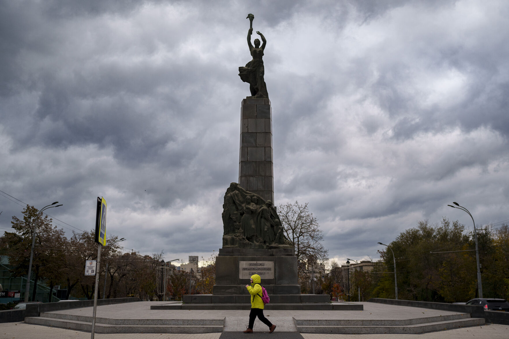 <p>FILE - A person walks by the monument of the Leninist Komsomol Heroes, a political youth organization in the Soviet Union, in Chisinau, Moldova, Monday, Nov. 4, 2024. (AP Photo/Vadim Ghirda, File)</p>   PHOTO CREDIT: Vadim Ghirda - staff, ASSOCIATED PRESS