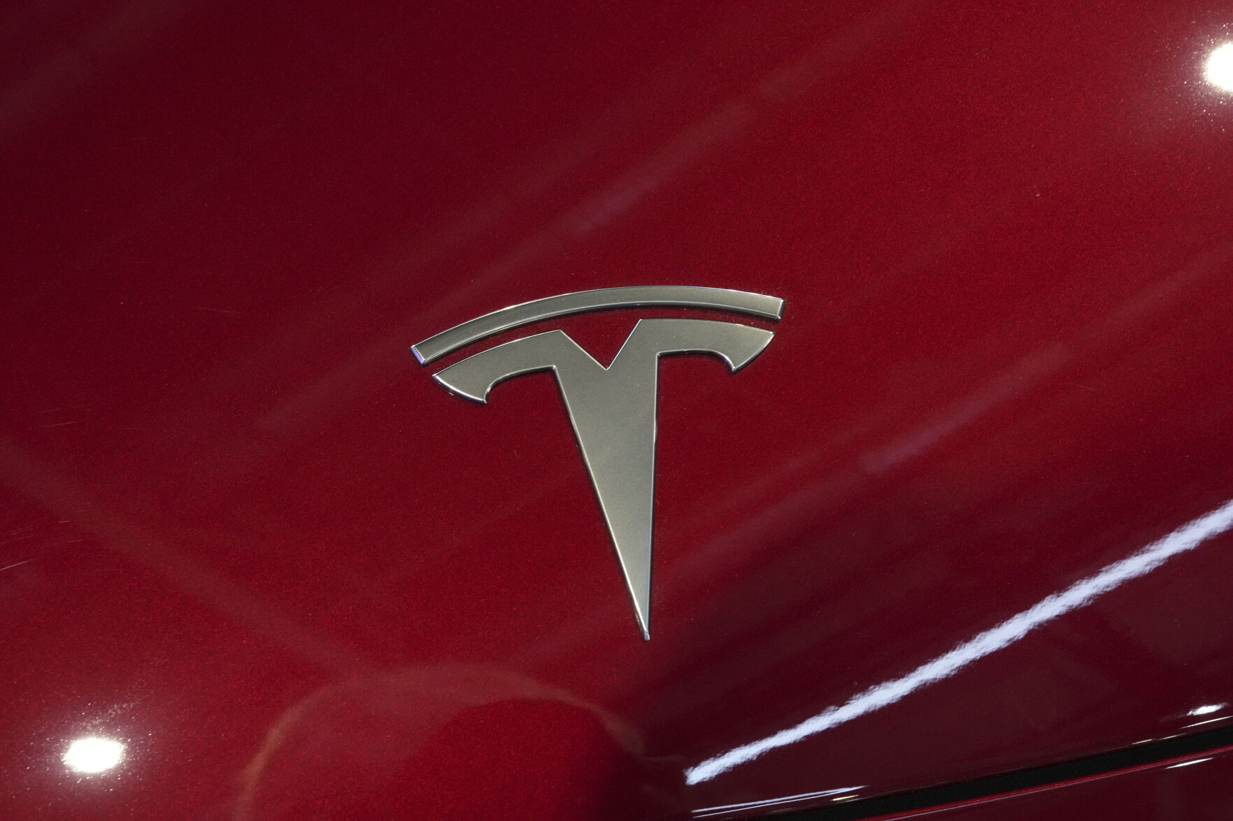 <p>FILE - The logo of Tesla car is pictured at the Paris Auto Show, in Paris, Oct. 14, 2024. (AP Photo/Michel Euler, File)</p>   PHOTO CREDIT: Michel Euler 