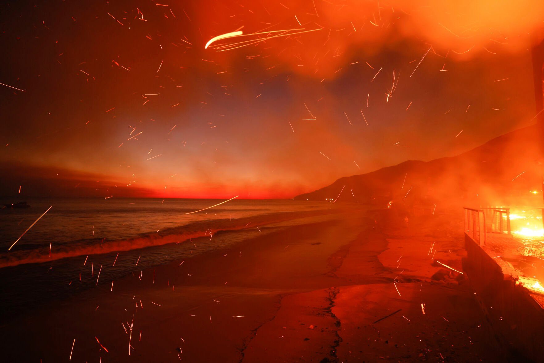 <p>The Palisades Fire burns a beach front property Wednesday, Jan. 8, 2025 in Malibu, Calif. (AP Photo/Etienne Laurent)</p>   PHOTO CREDIT: Etienne Laurent 