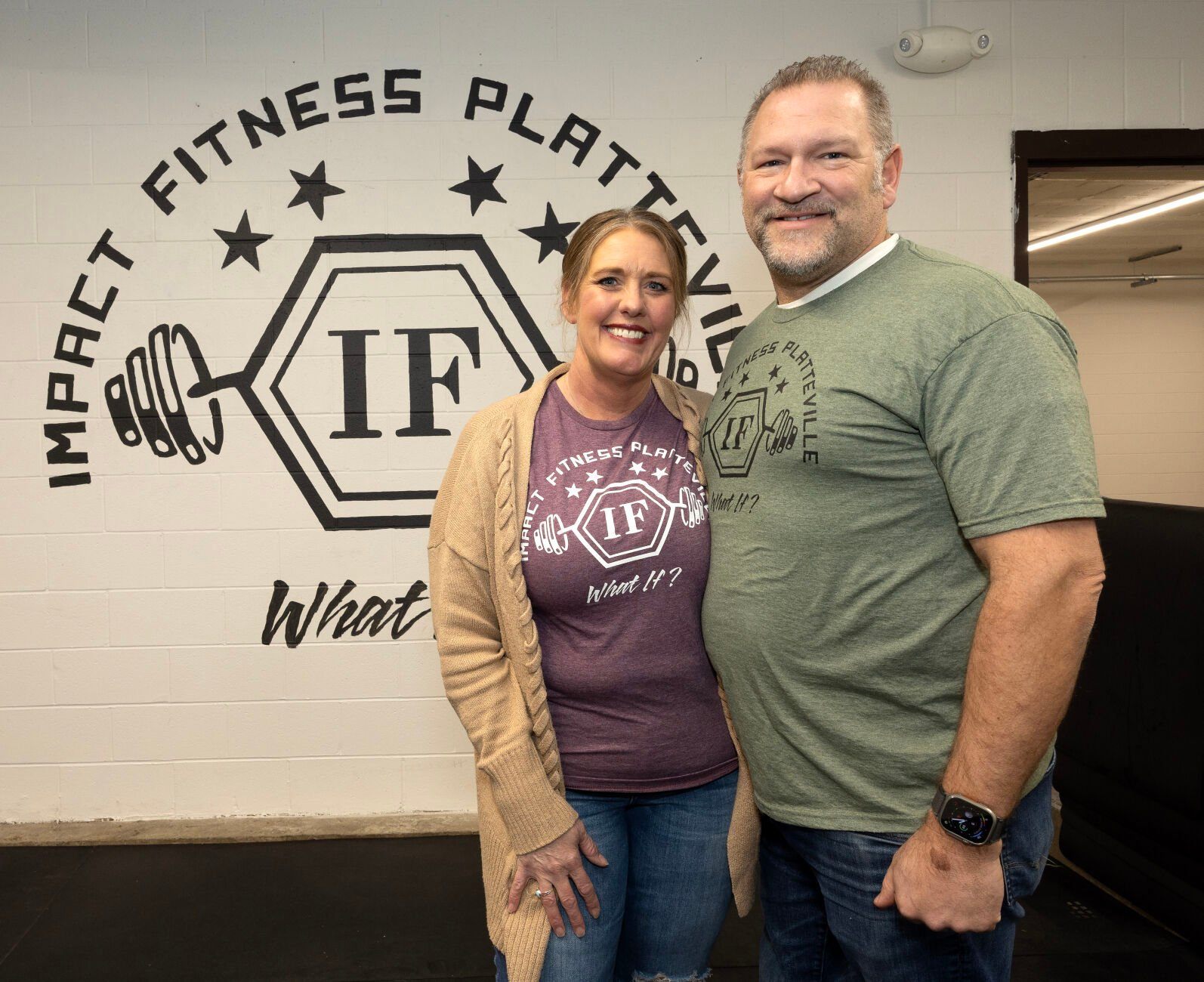 Owner Christina Sonsalla and her husband, Drew, pose at Impact Fitness in Platteville, Wis., on Thursday.    PHOTO CREDIT: Gassman