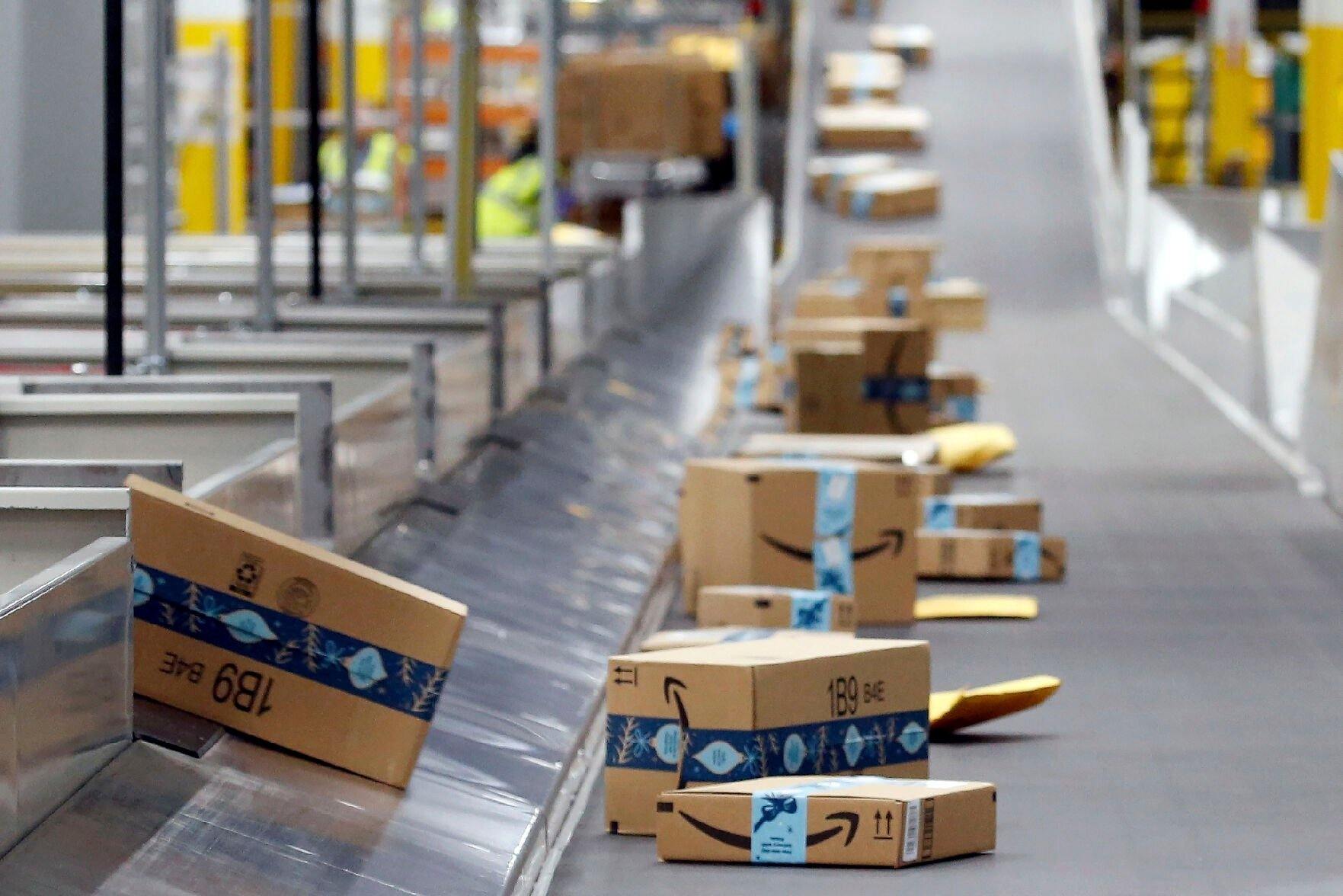 <p>FILE - Amazon packages move along a conveyor at an Amazon warehouse facility, Dec. 17, 2019, in Goodyear, Ariz. (AP Photo/Ross D. Franklin, File)</p>   PHOTO CREDIT: Ross D. Franklin